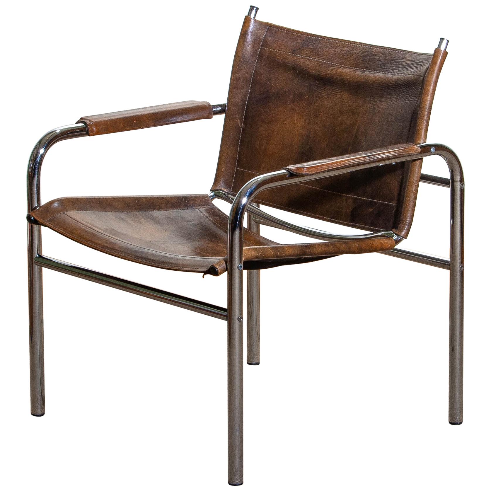 Beautiful armchair, model Klinte, designed by Tord Bjorklund, Sweden. The chair has a tubular chromed steel frame with brown-taupe leather back / seating and armrests with a beautiful patina.
Period 1980.

Note: We have two of these chairs in