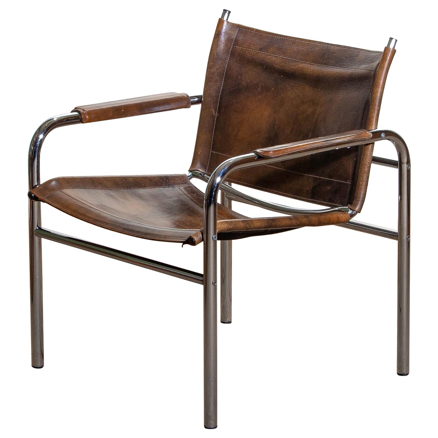 Beautiful armchair, model Klinte, designed by Tord Bjorklund, Sweden. The chair has a tubular chromed steel frame with brown-taupe leather back / seating and armrests with a beautiful patina.
Period: 1980.

Note: We have two of these chairs in
