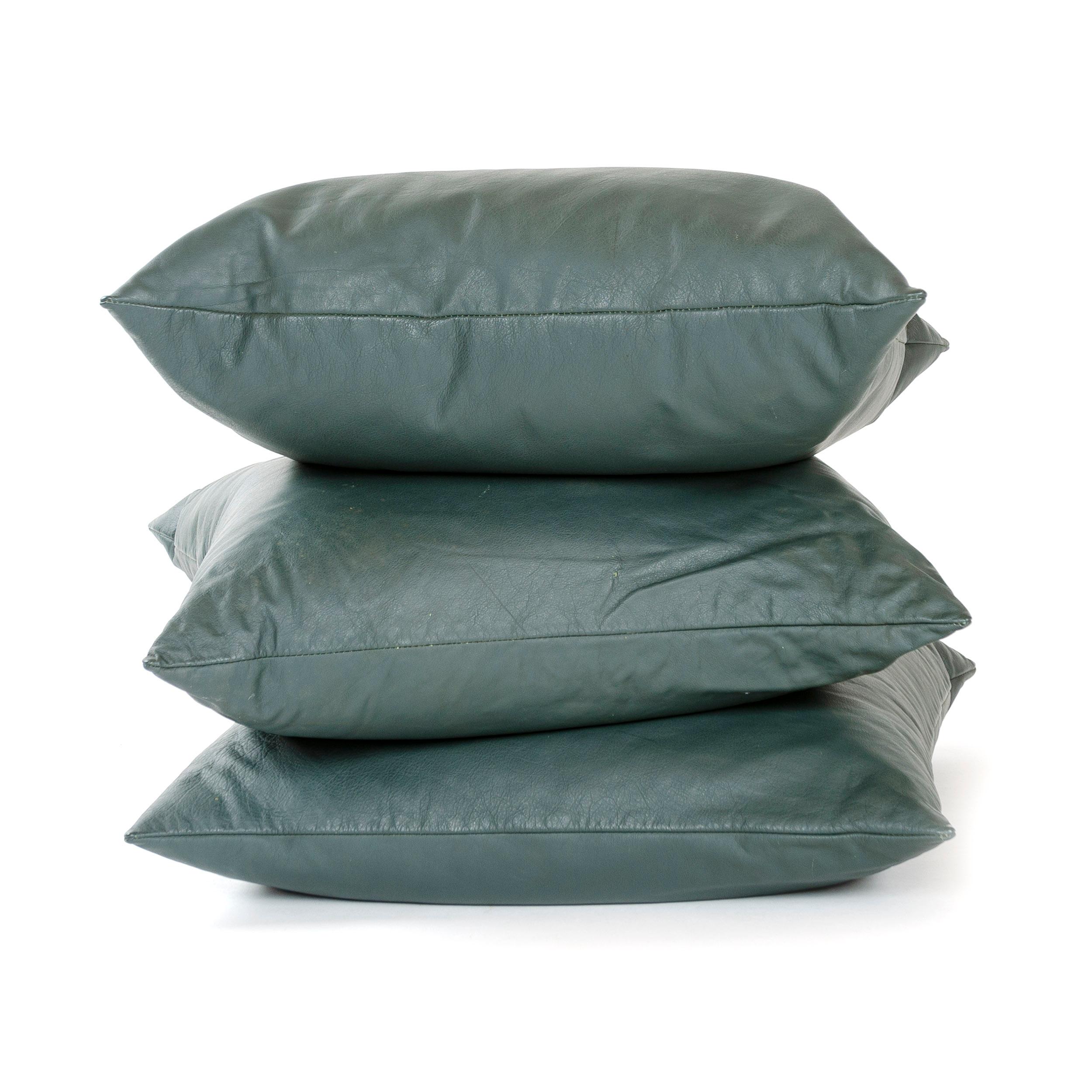 A handmade green leather pillow.