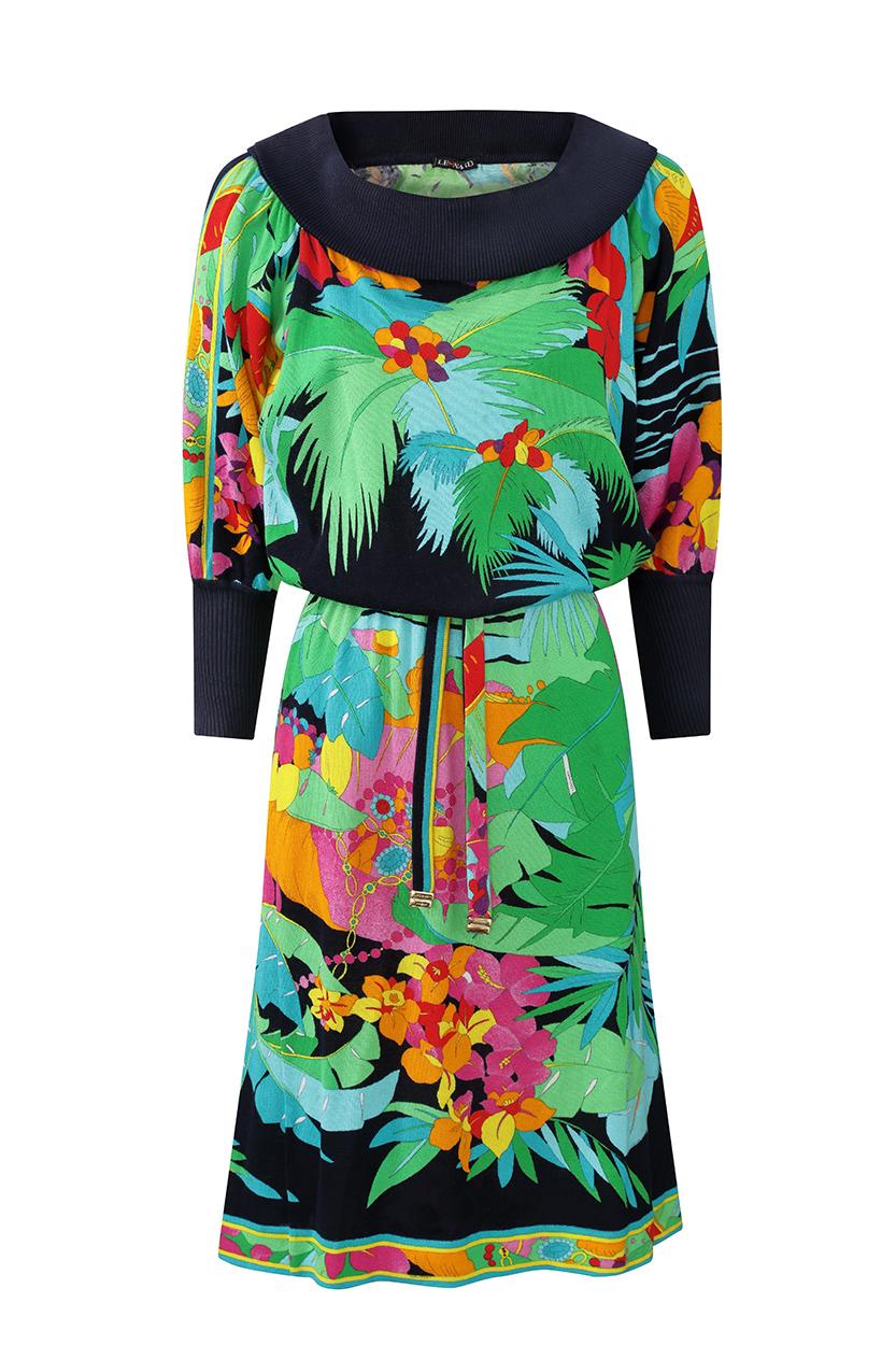 This colourful 1980s tropical print knitted dress is from Leonard studios and is in beautiful vintage condition having retained all of its original vibrancy. Featuring a Bardot neckline, batwing sleeves tapered at the wrists, a drop waistband and