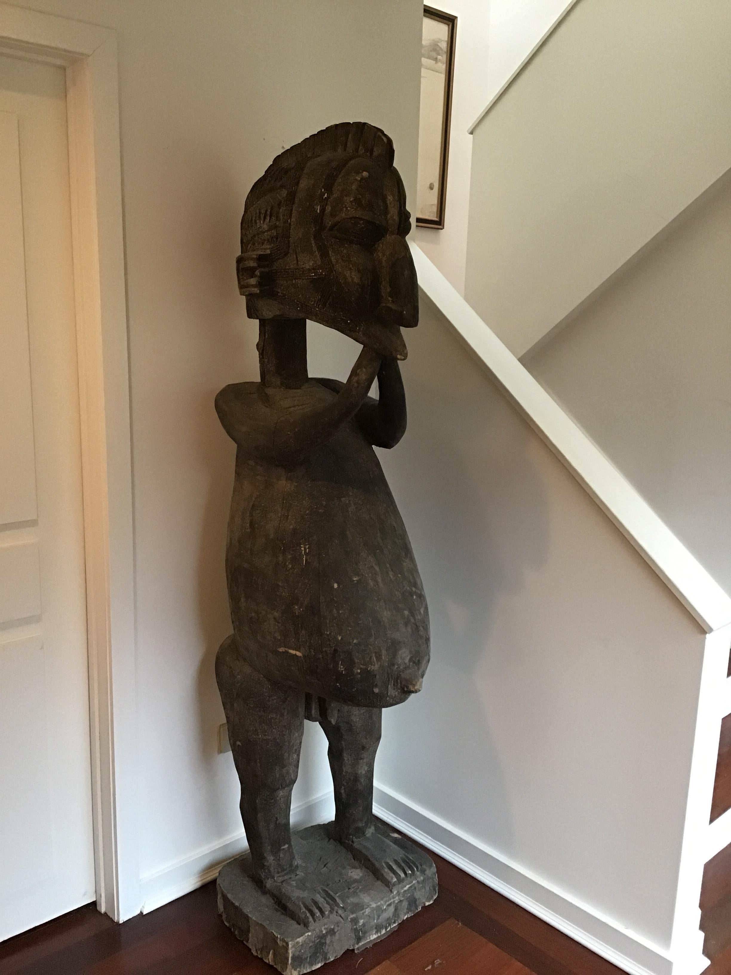 1980s life-size African carved wood fertility statue. Acquired from a Greenwich, Connecticut estate.