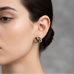 Orecchini a clip in metallo con logo anni '80 di Valentino Garavani