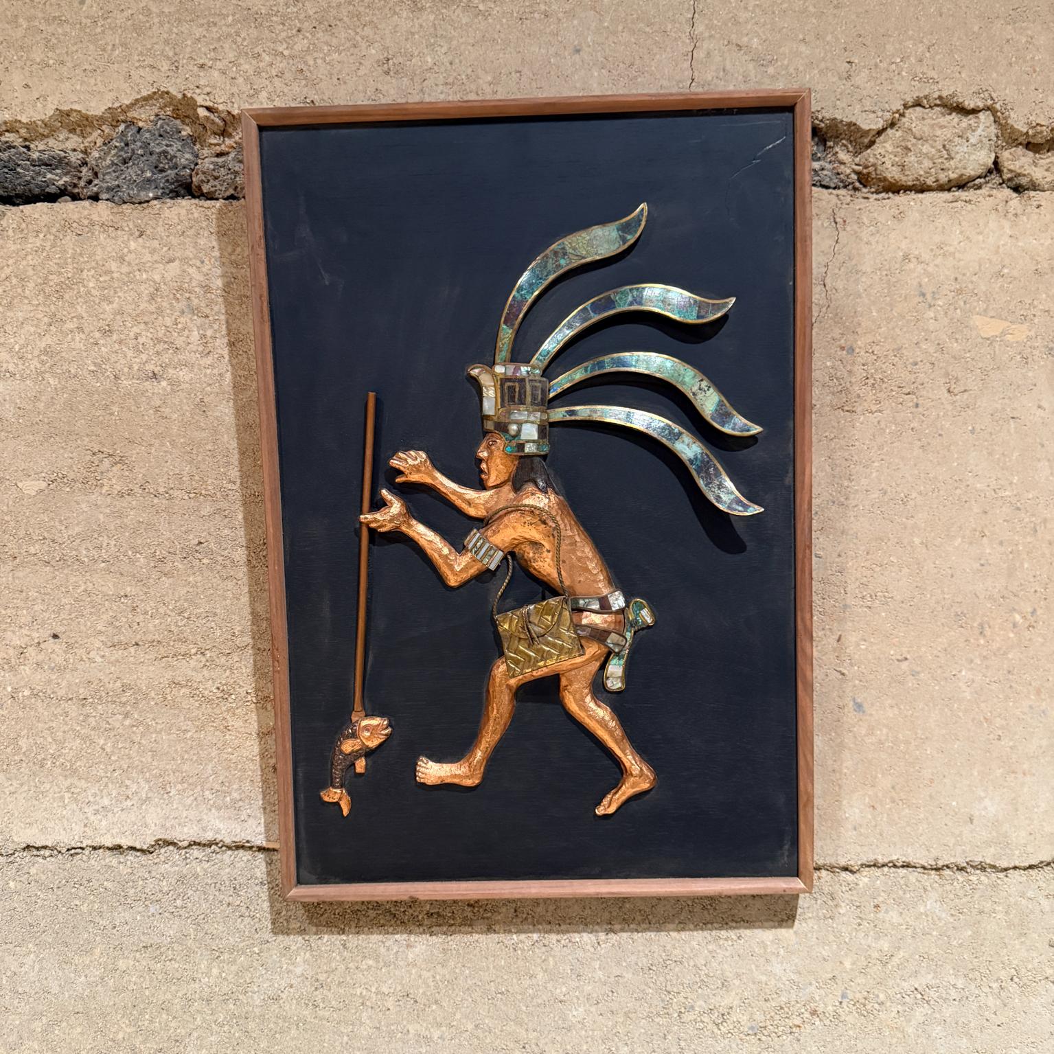 1980s Mayan Wall Art mixed metals
attributed to Los Castillo. 
Beautiful Mayan Revival technique Mosaico Azteca
Unmarked
bronze and malachite copper
20.5 H x 14.25 W x 1.5 D
Made in Mexico 
Original vintage condition. 
Wood panel and frame were
