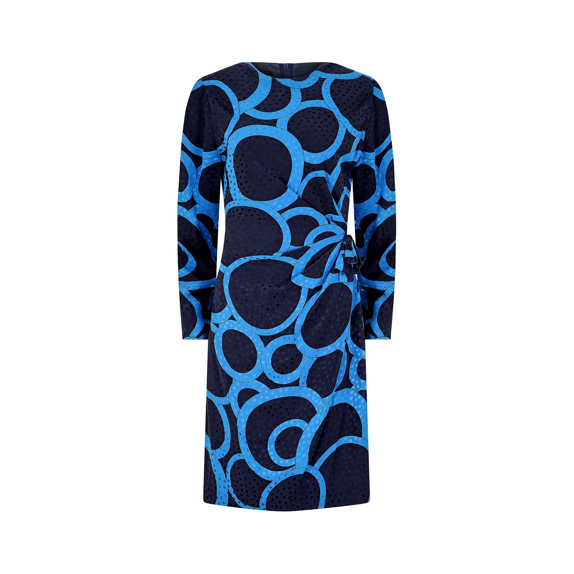 Bold and bright late 1980s silk jacquard dress by Louis Feraud. It has a high, rounded neckline and long sleeves which are padded at the shoulder to create a distinctly 80s structured silhouette. It fastens down the back with the original zipper,