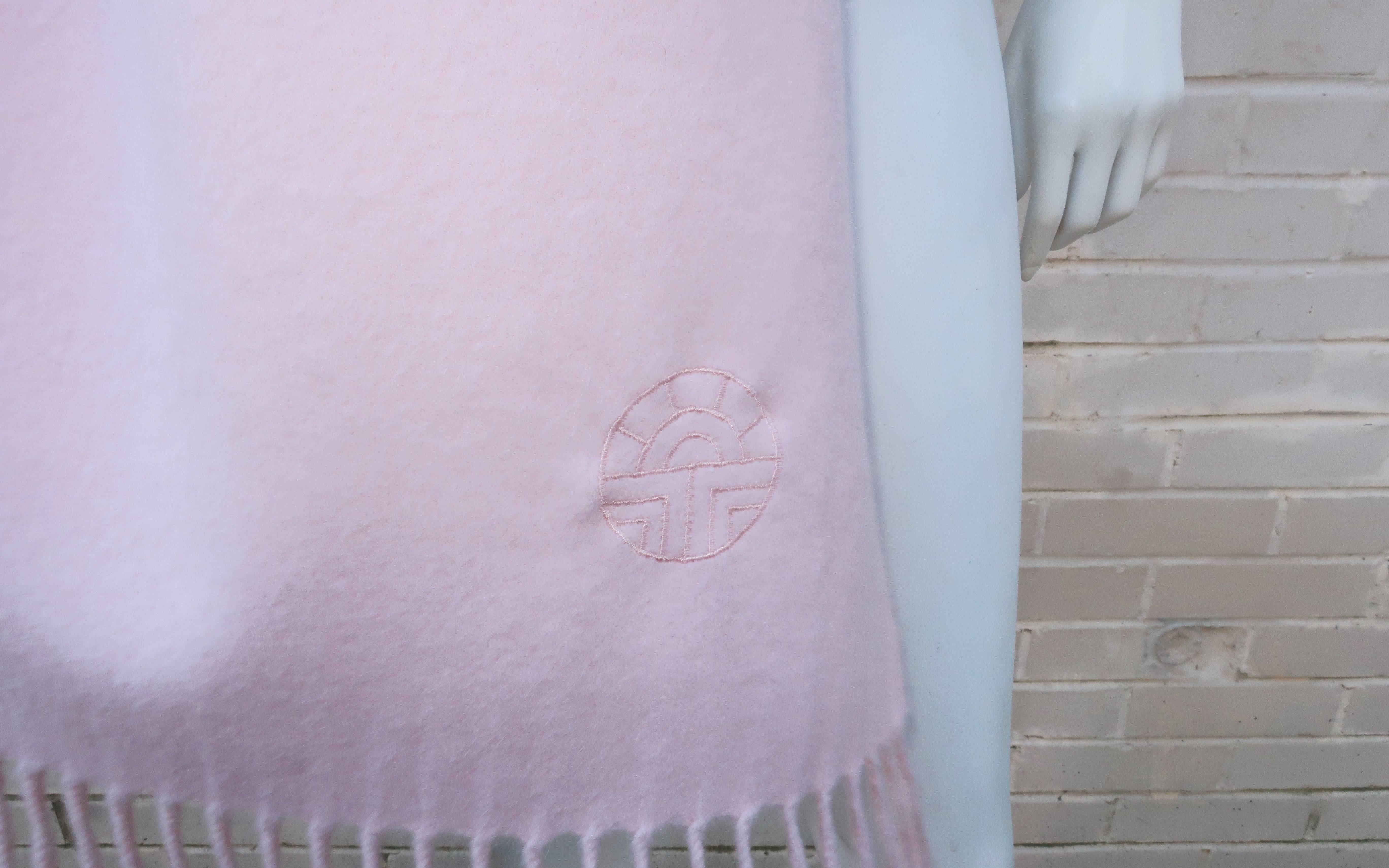Wrap yourself in powder pink luxury with this 1980's Louis Feraud cashmere scarf.  Measuring 80.5