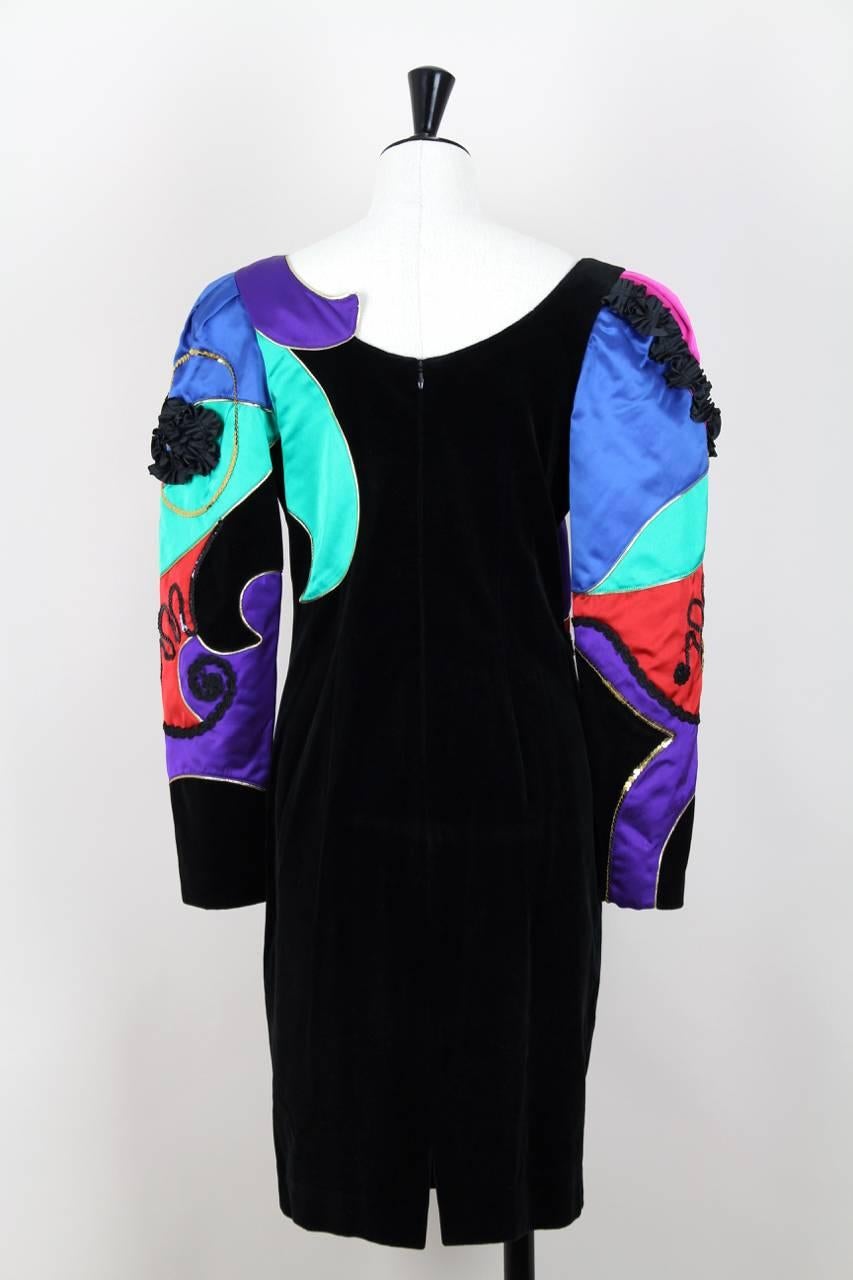This is an exquisite 1980s elaborately beaded and sequined Louis Féraud black pure cotton velvet and vibrant coloured satin cocktail dress. The knee-length dress features an abstract designed bodice in pink, red, vibrant green, blue and purple satin