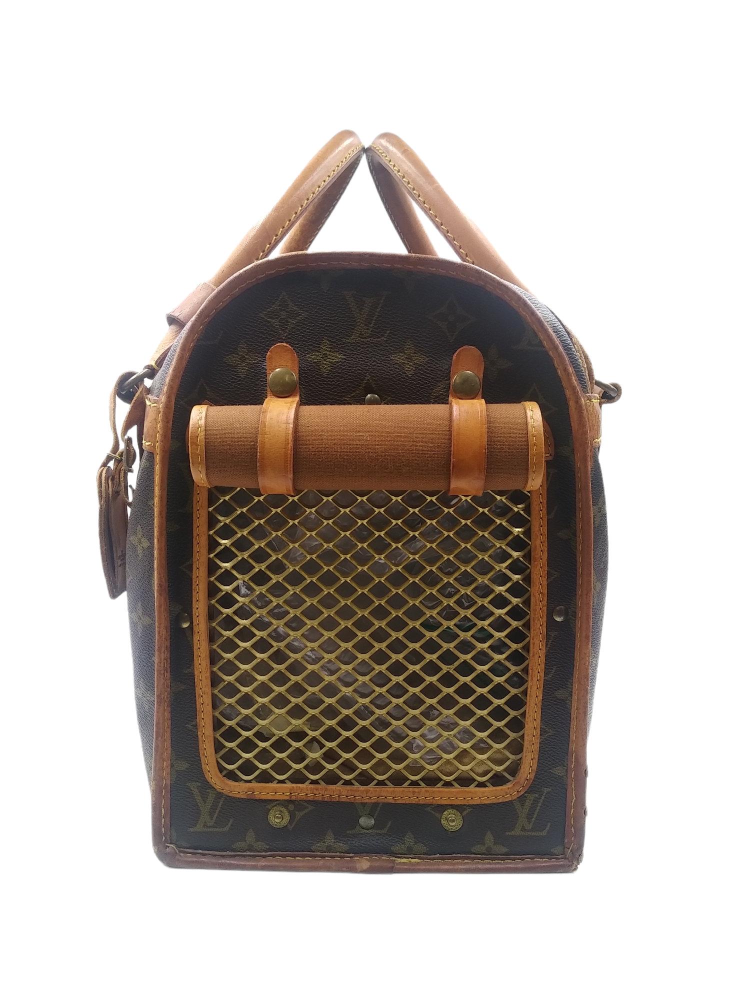 1980s Louis Vuitton Monogram Canvas Sac Chien 40 Dog Carrier
- 100% authentic Louis Vuitton
- Monogram coated canvas with leather trim
- Double rolled leather handles
- Two-way zip closure
- Hardware goldtone