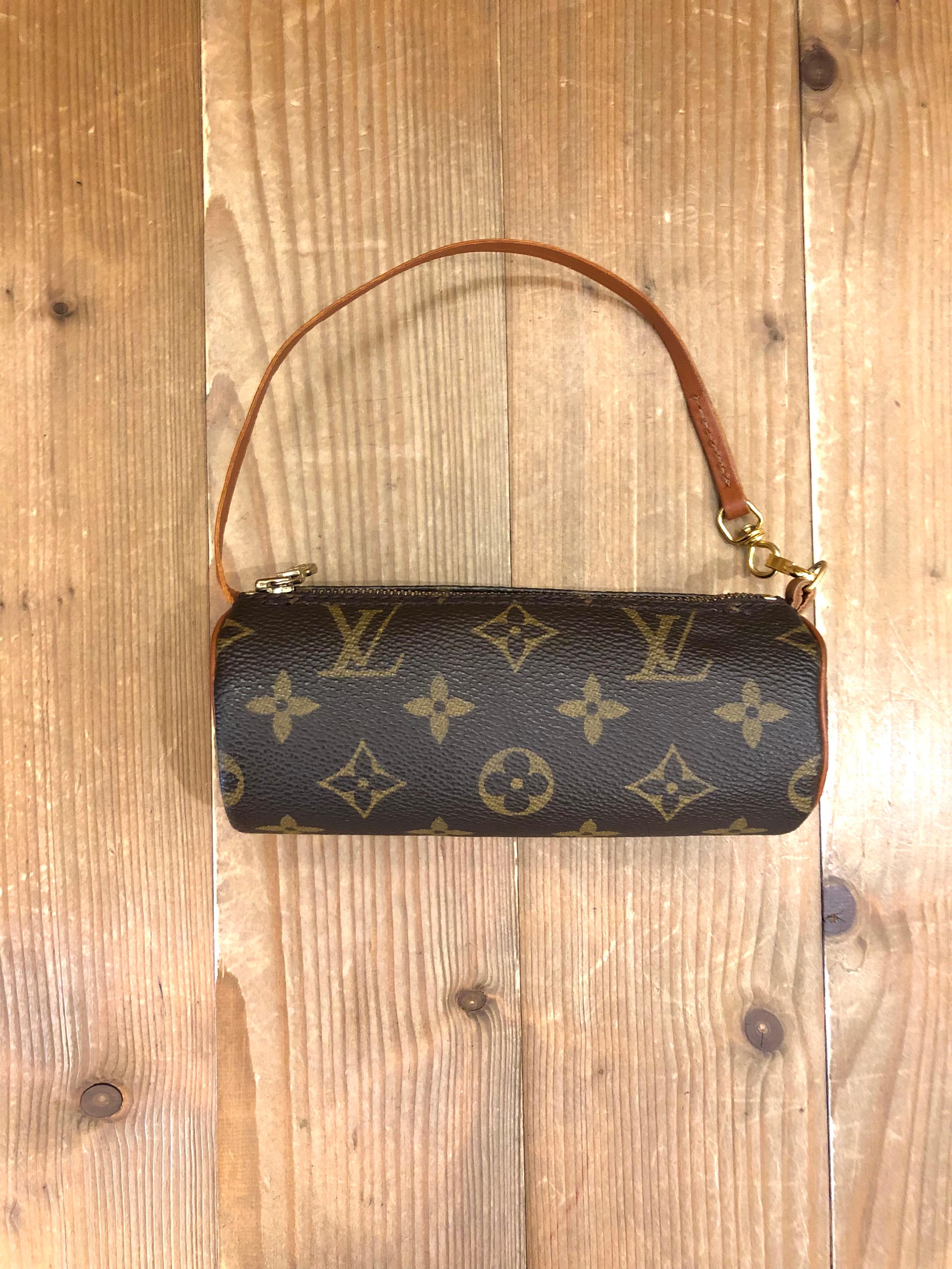 1990s Vintage LOUIS VUITTON mini Papillon pouch in brown monogram canvas and leather. Measures 6.25”x 2.25”x 2.25”. Comes with complimentary non-LV chain.

Condition - Minor signs of wear. Generally in very good condition.