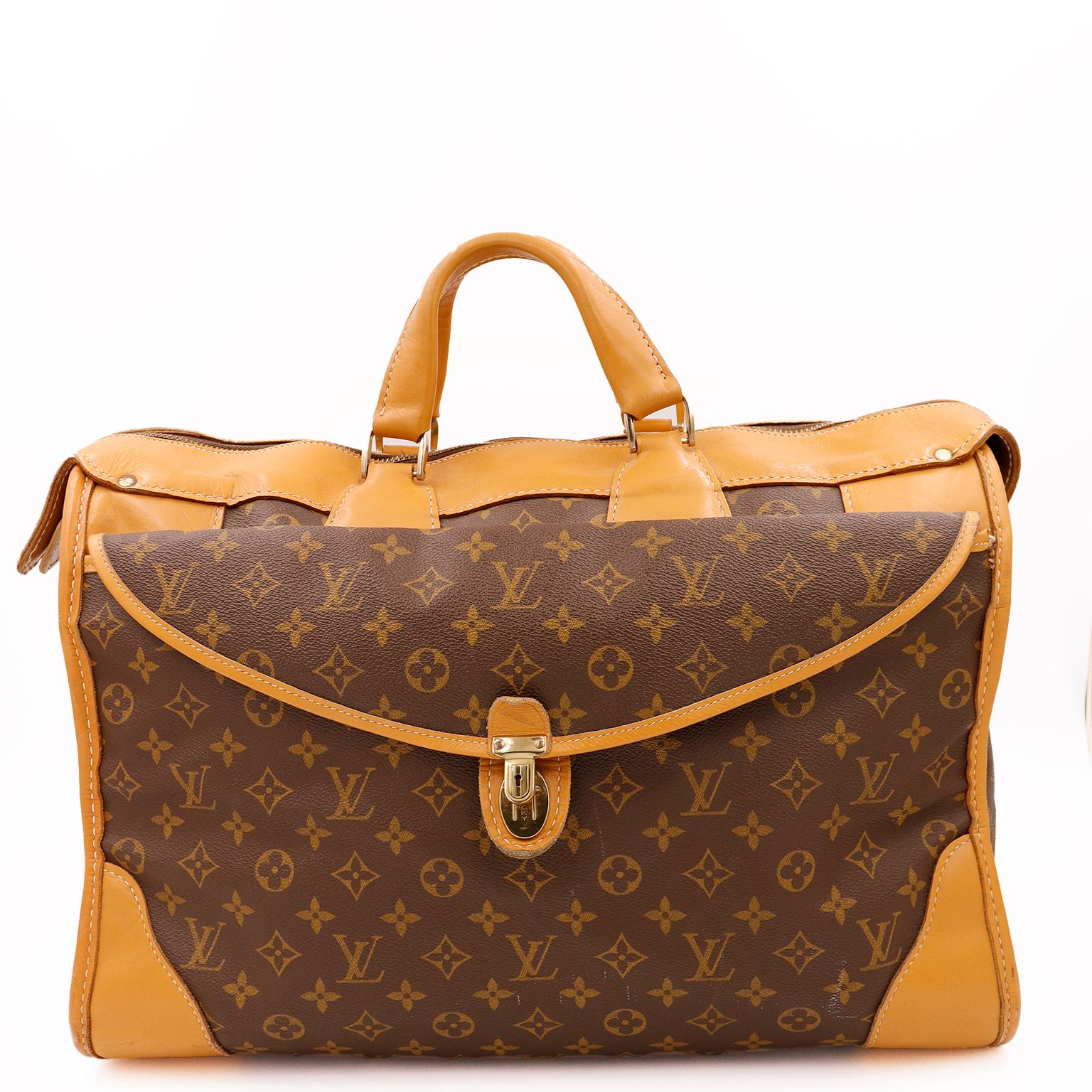 This rare vintage 1980's Louis Vuitton monogram canvas and leather weekender travel bag was made in the USA for Louis Vuitton by the French Luggage Company.

In response to the high demand for Louis Vuitton bags in the US in the 1970's. the company