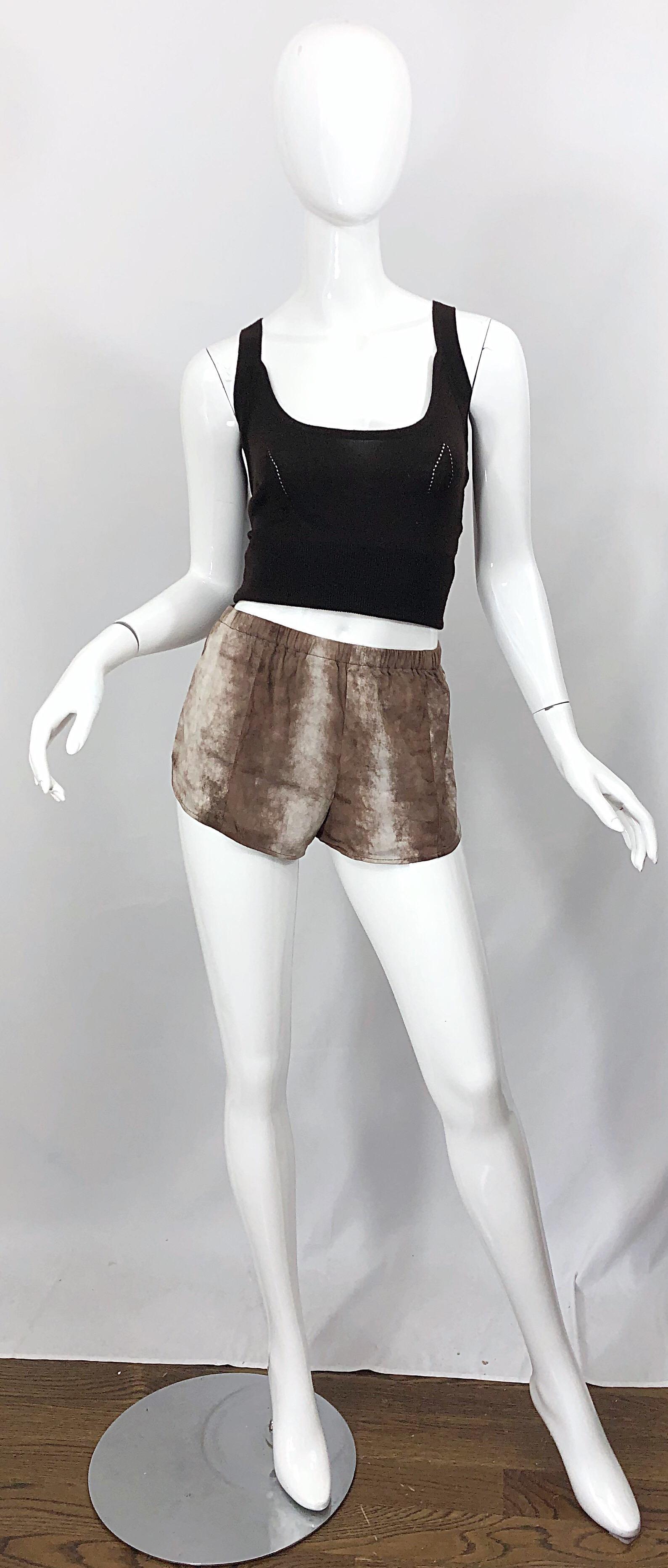 Amazing and collectible LOVE, MELODY early 80s sheepskin leather hot pants / shorts! Super soft ombre brown and taupe sheepskin leather with an elastic waistband that stretches to fit. Track style that is so on trend right now! The brown cashmere