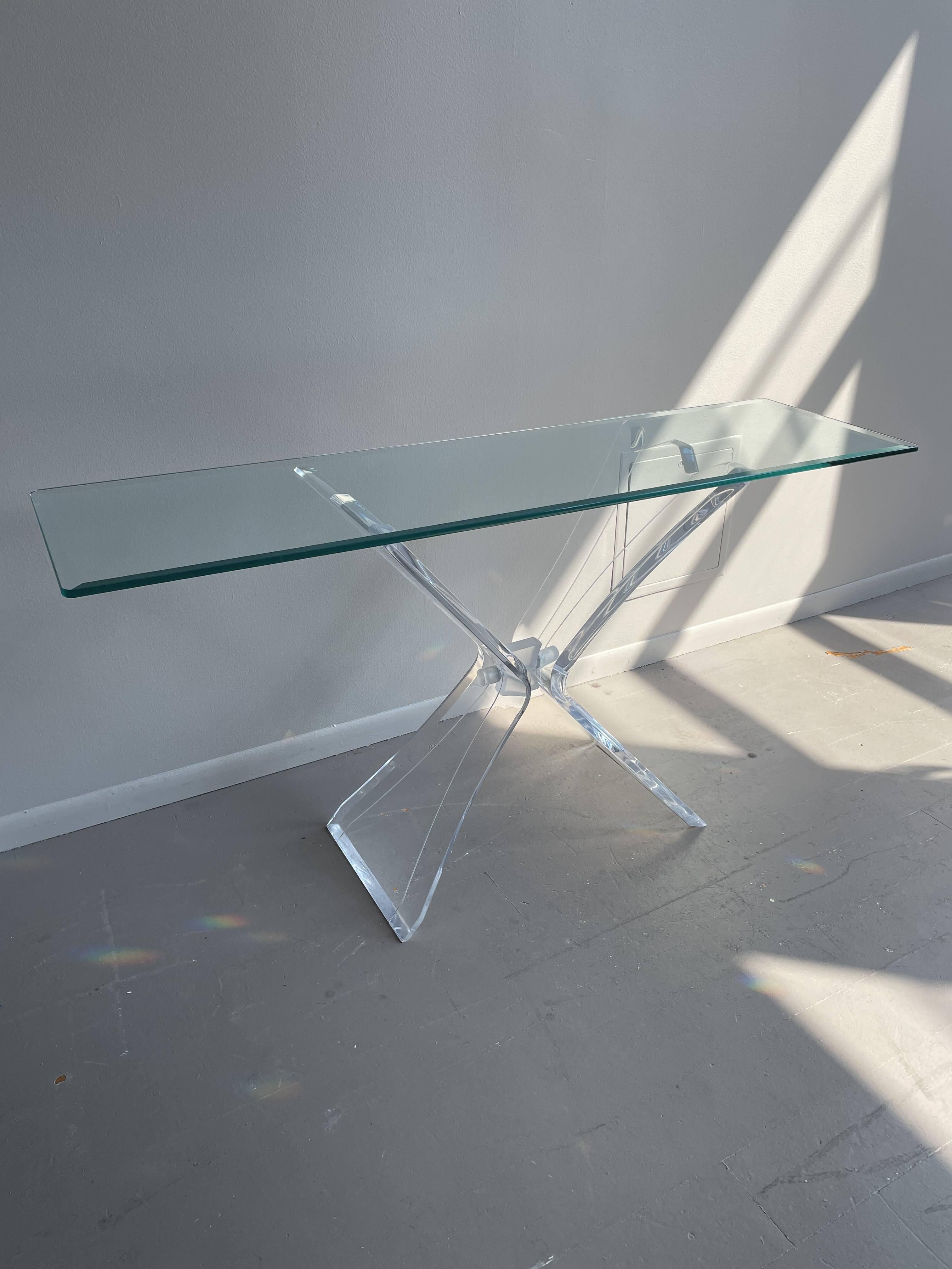 Absolutely stunning console table. No labels. The base is lucite and beveled glass top.

Dimensions: 56