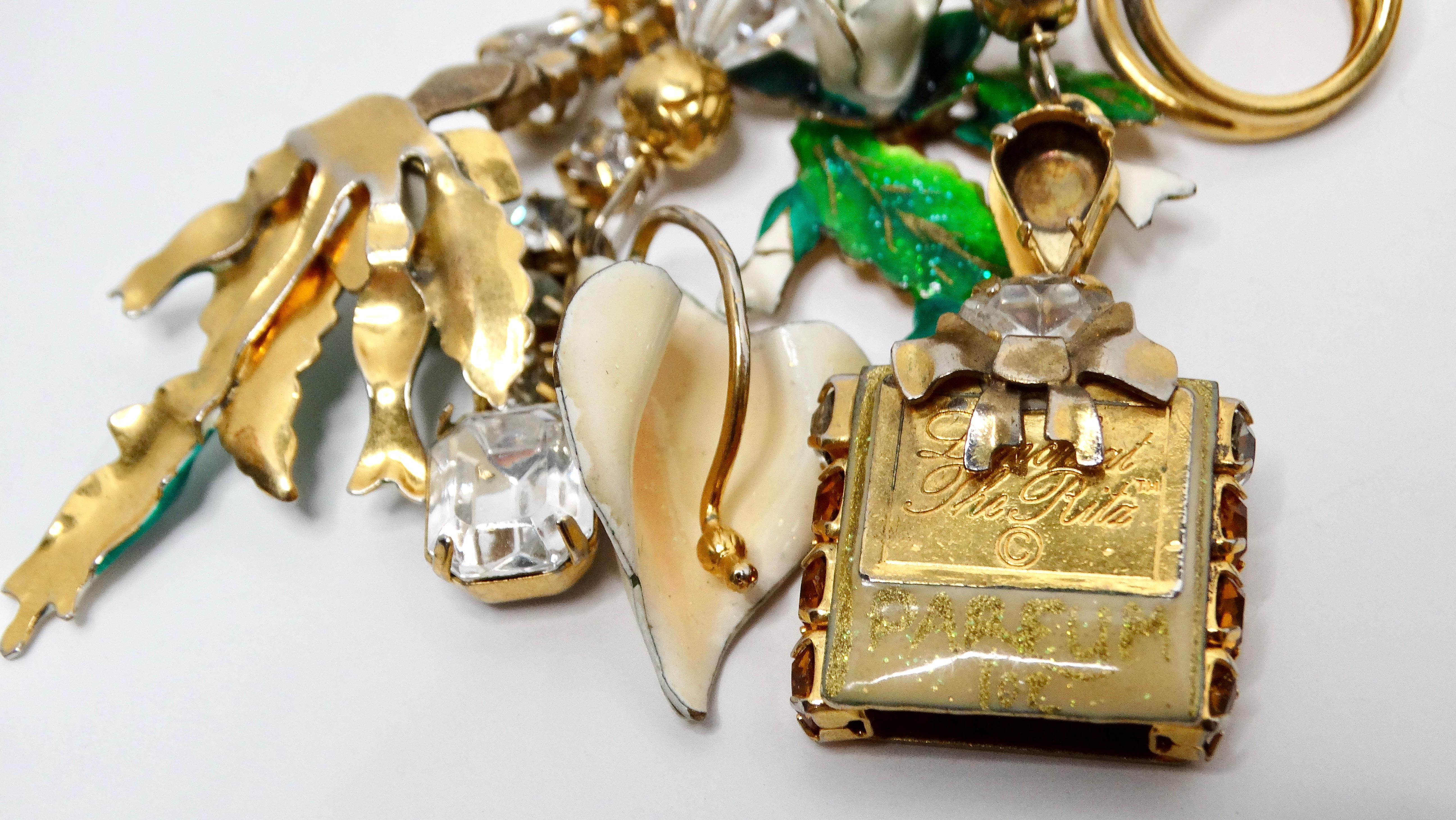 Elevate your accessory game with the exquisite 1980s Lunch At The Ritz Maximalist Charm Dangle Earrings. These striking earrings feature an 18k gold plating, showcasing a stunning array of rhinestone charms that include playful representations of