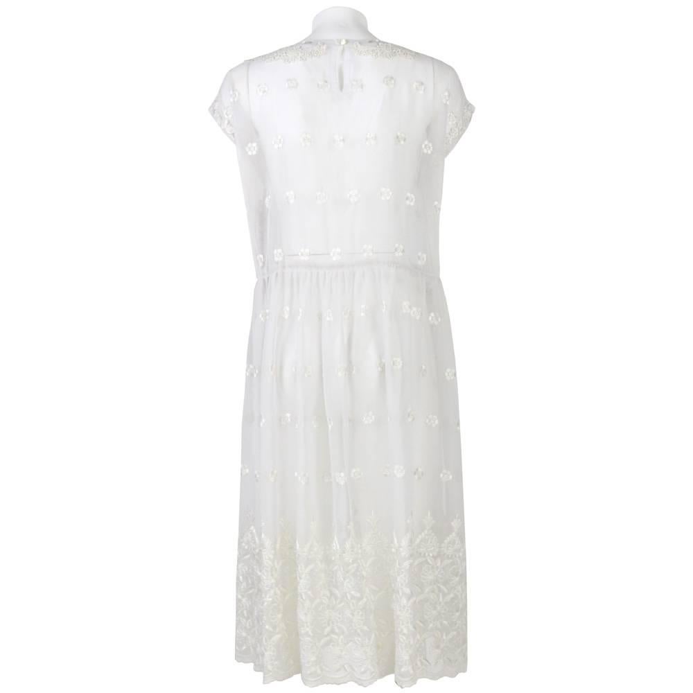 A.N.G.E.L.O. Vintage - Italy

Beautiful see-through wedding dress, featuring floral embroidery, short sleeves.

Size: M.

Measurements:
lenght 112 cm:
bust:48 cm
waist:48 cm