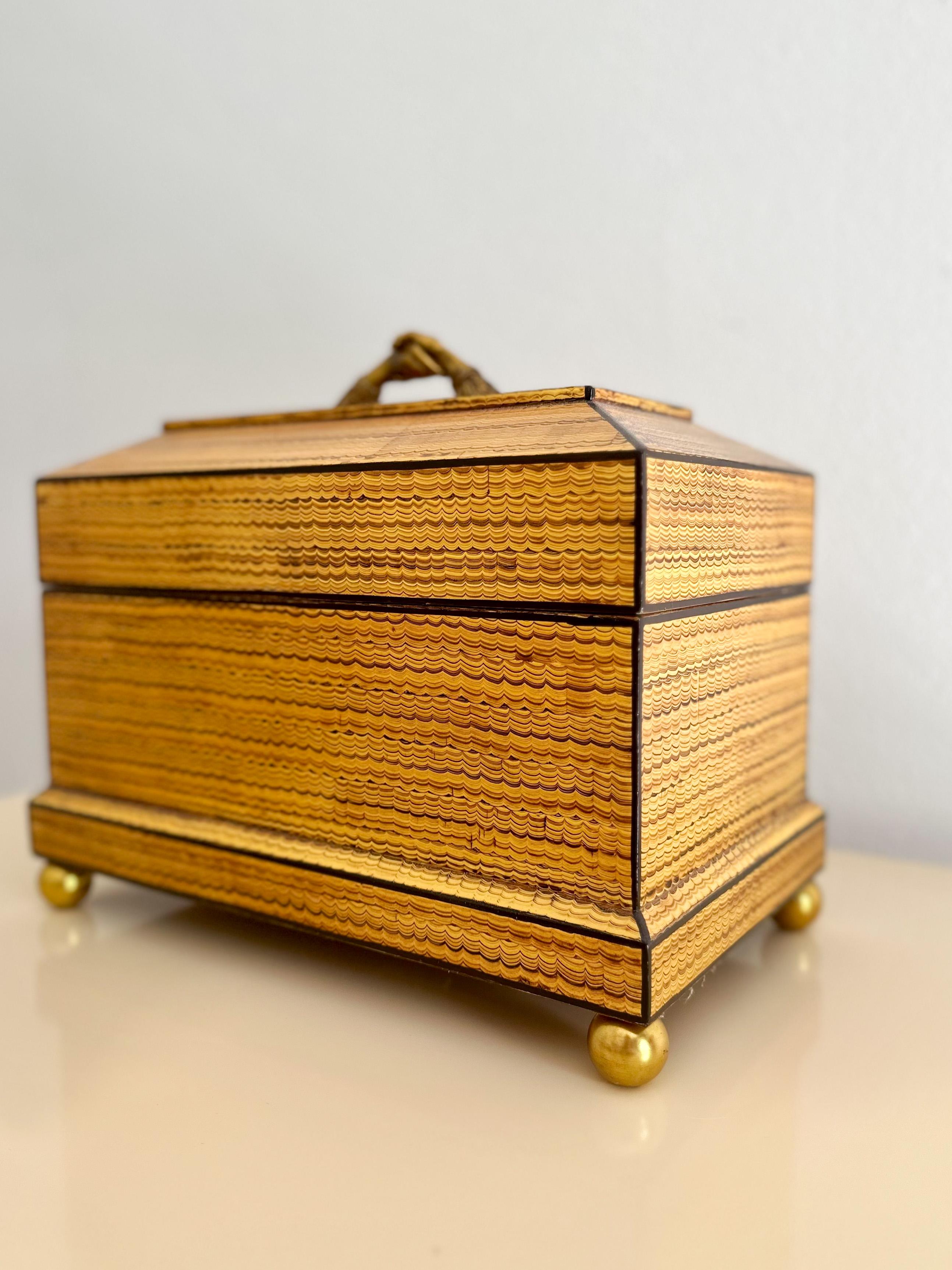 Absolutely gorgeous limited-production Maitland Smith humidor with Spanish cedar lining, humidifier, and hygrometer, hand-crafted in the Philippines. Warm honey-toned combed finish with ebony trim, brass ball feet, and brass handle shaped like two