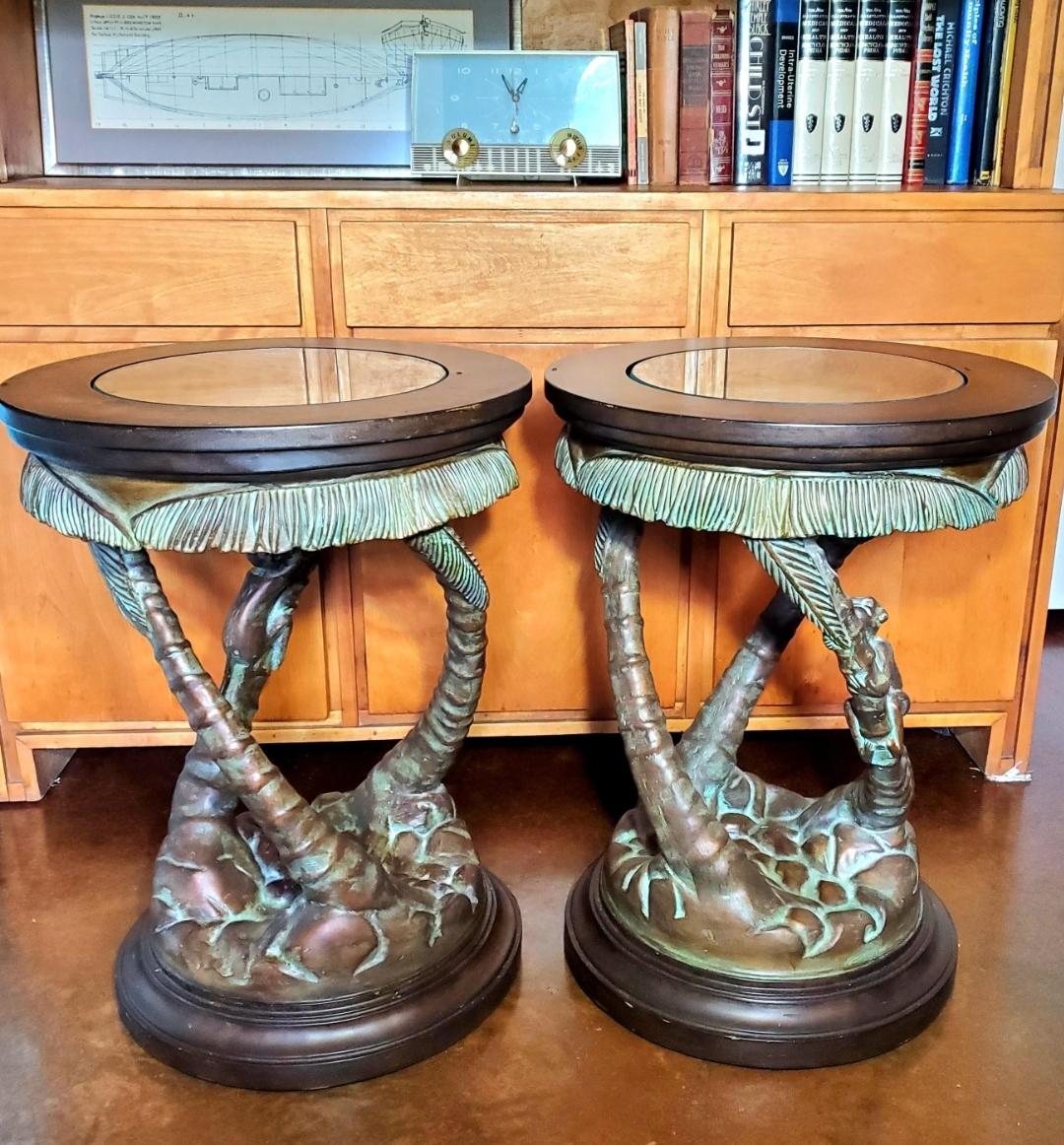 Maitland Smith
A pair of glass topped pedestal side tables. The round table has a 1/2