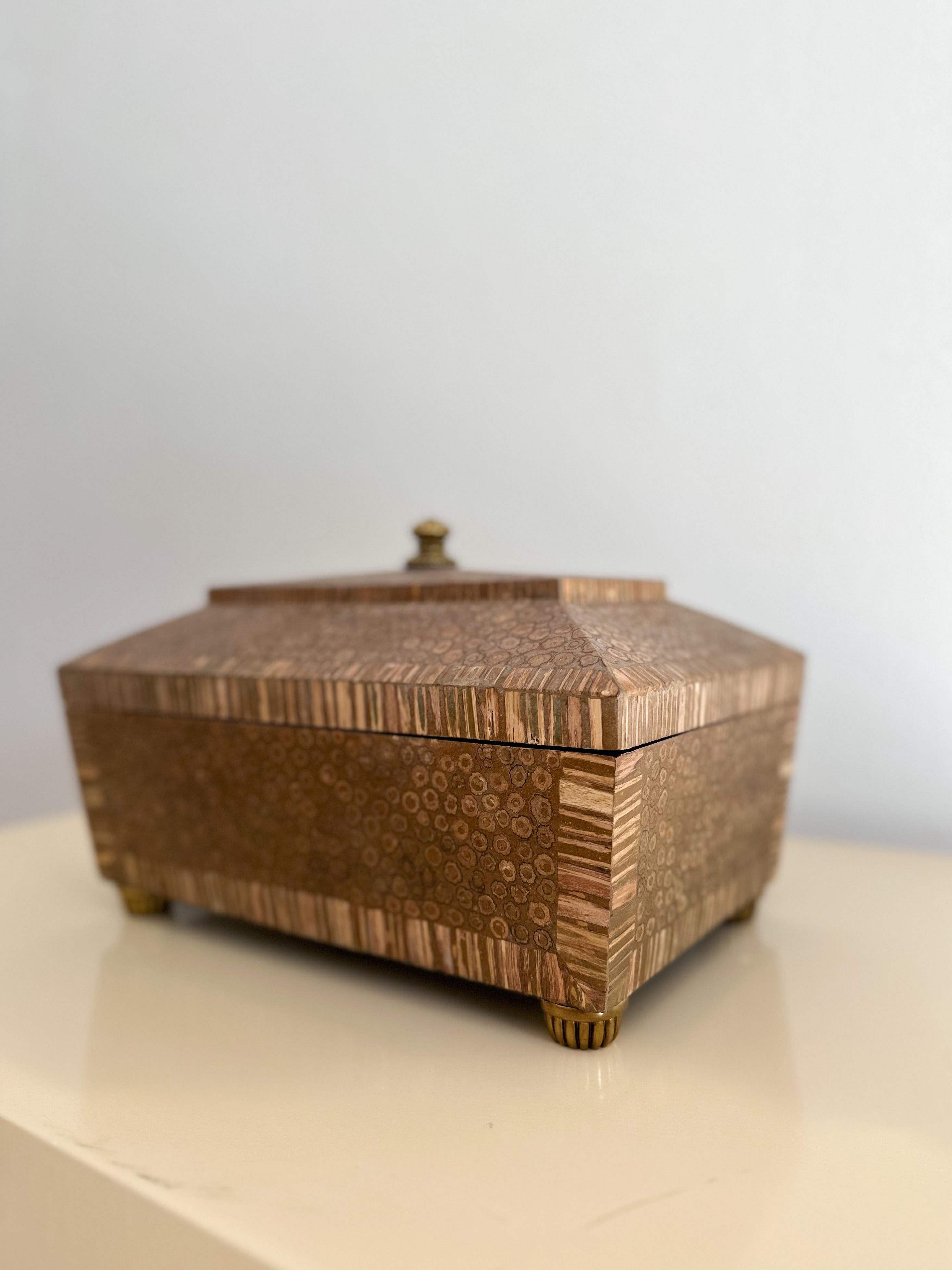 Beautiful Maitland Smith box with resin-encased stem-end finish, mahogany inlay, and brass accents, handcrafted in the Philippines, circa 1980s. Intriguing, organic construction out of what we believe are plant stems encased in resin, this piece has