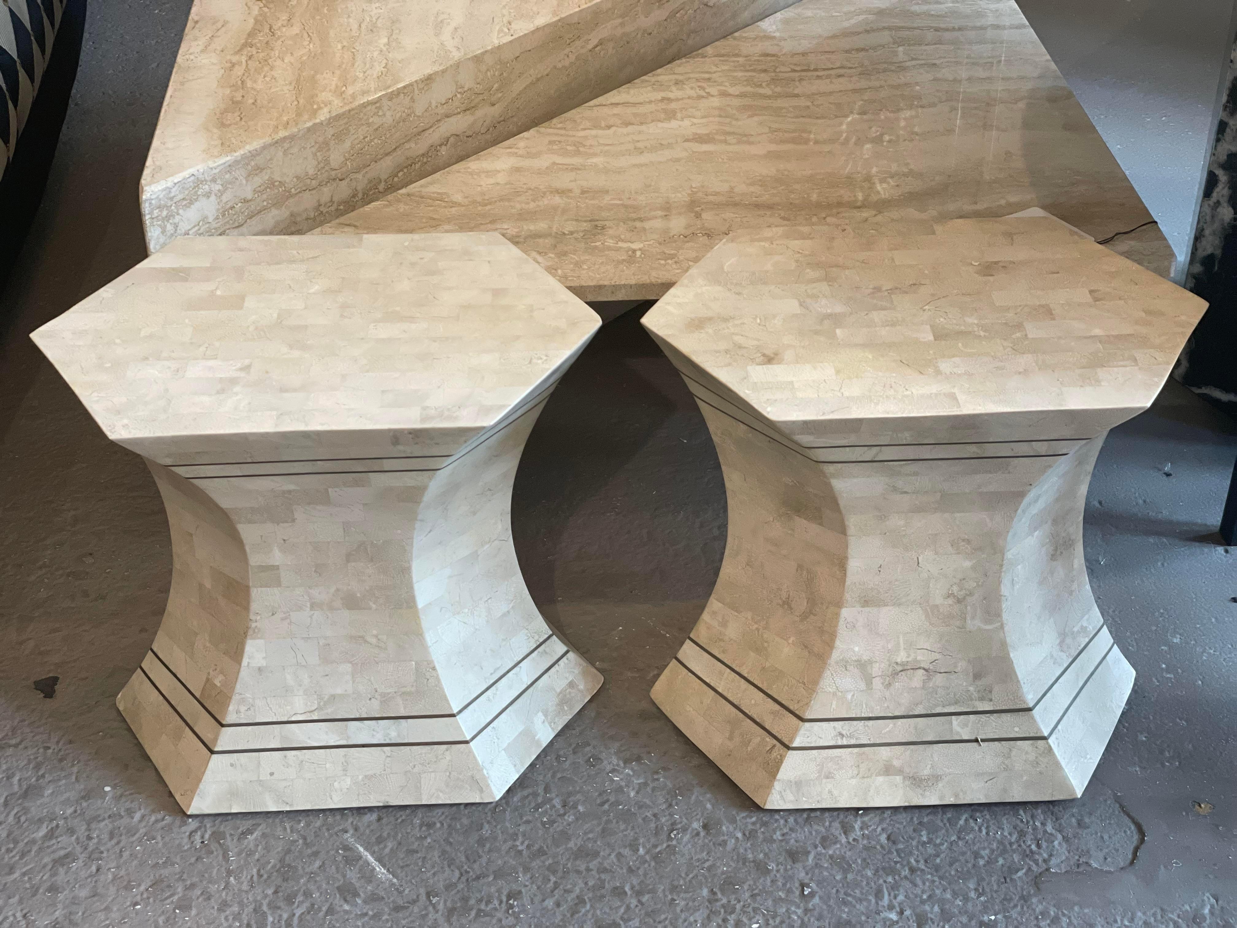 Adorable little sides tables made from tessellated stone with brass detailing. These are in excellent condition and can be used as stools or tables.
