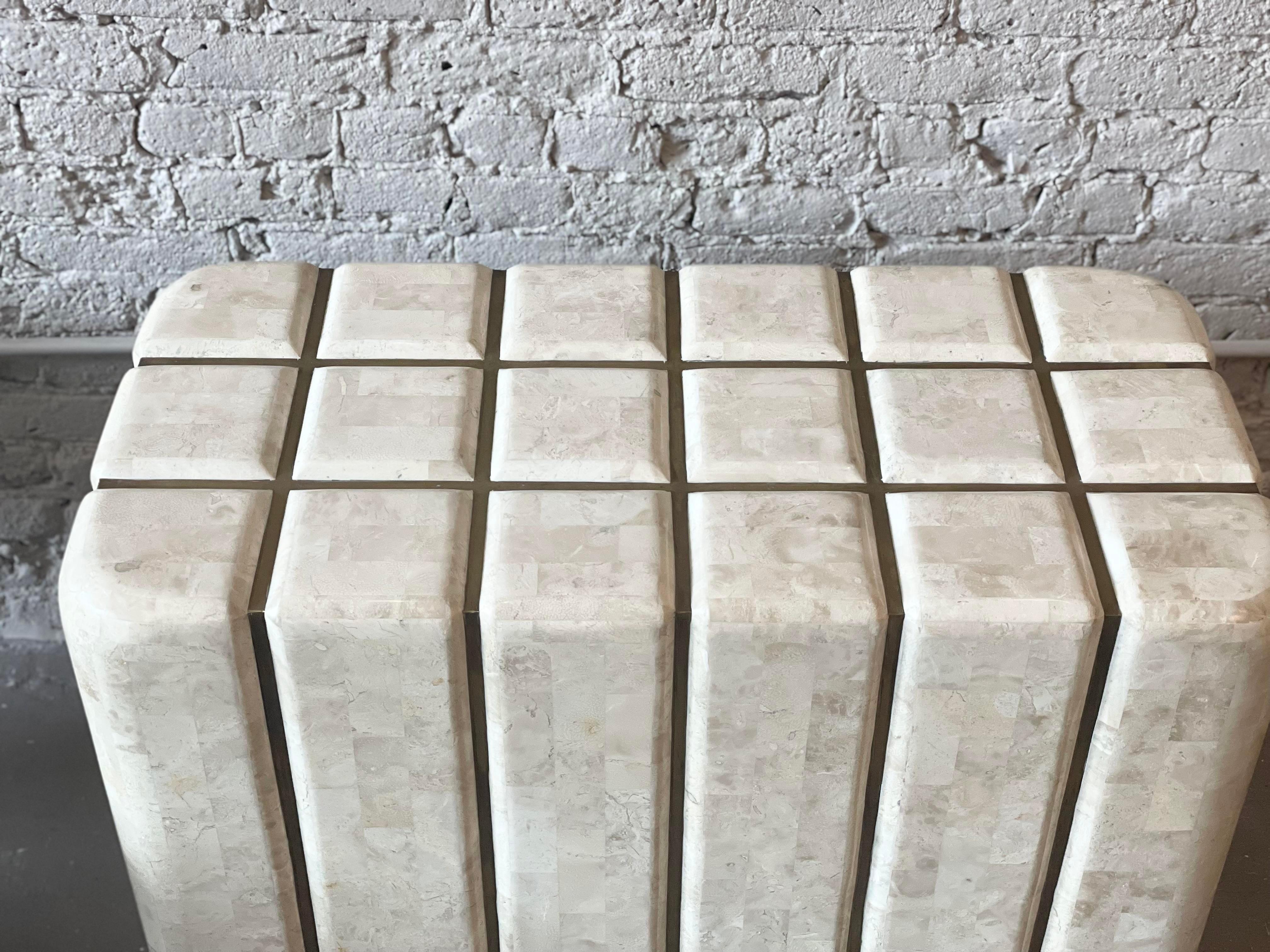 I have never seen this before! Believed to be custom made by Maitland Smith, the pedestal base has vertical lines of brass. Impeccable condition. The glass oval top shown is how the original owner had the table displayed and comes with the base.