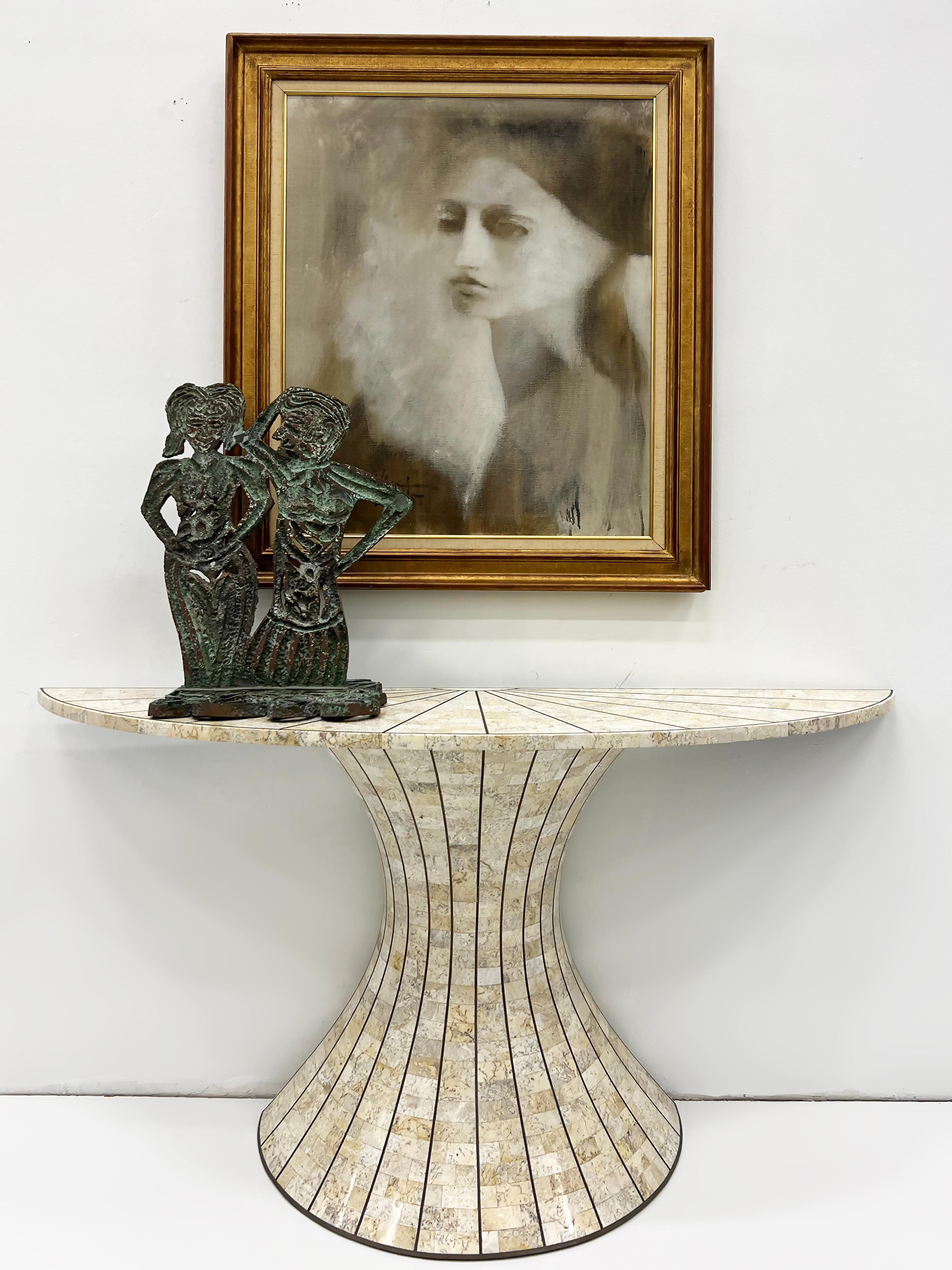 1980s Maitland-Smith Tessellated Stone Console Table with Brass Inlay

Offered for sale is a 1980s Postmodern tessellated stone and inlaid brass console table by Maitland-Smith. The table has a demilune form and is created with a sunburst design