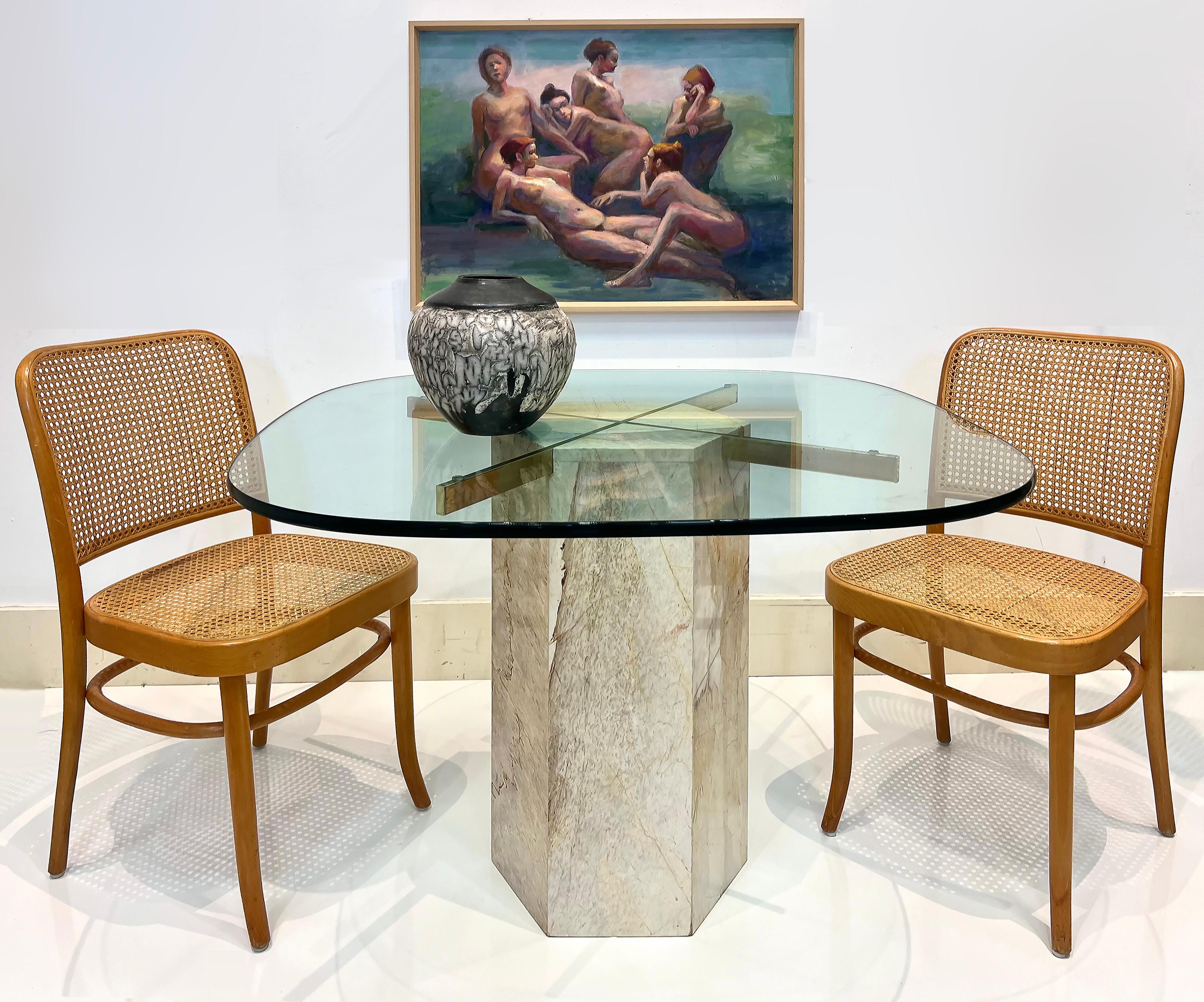 1980s Marble and Brass Ello Game Dining Table with Glass Top

Offered for sale is a 1970s -1980s marble and brass table by Guy Barker for Ello Furniture Company with a thick glass top. The marble has a beautiful veining with brass supports that are