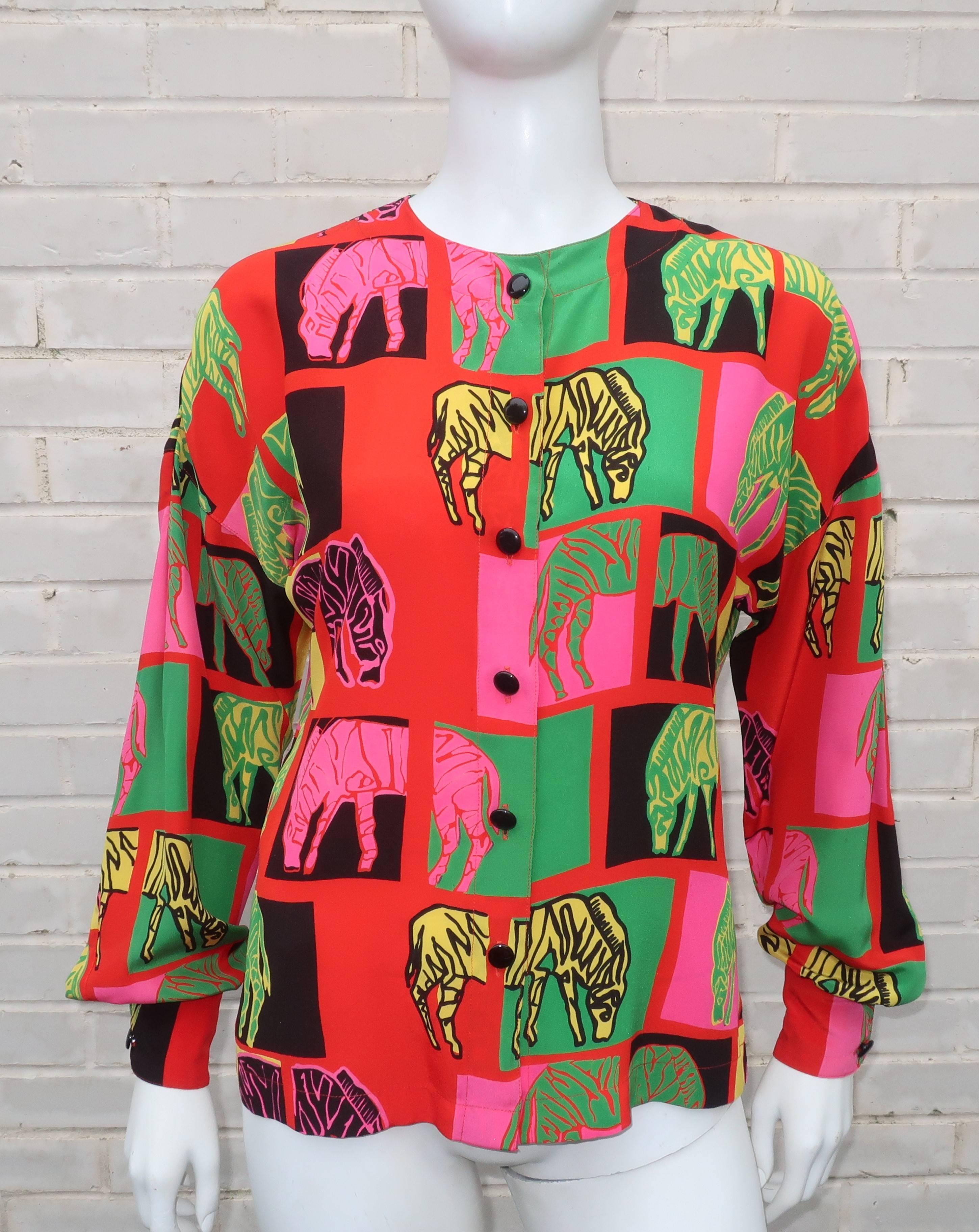 Pop art at its finest!  This Margaretha Ley silk blouse for Escada has graphic animal print images in neon colors reminiscent of Andy Warhol's art from an earlier era.  The beautifully made silk blouse buttons at the front with a rounded shoulder