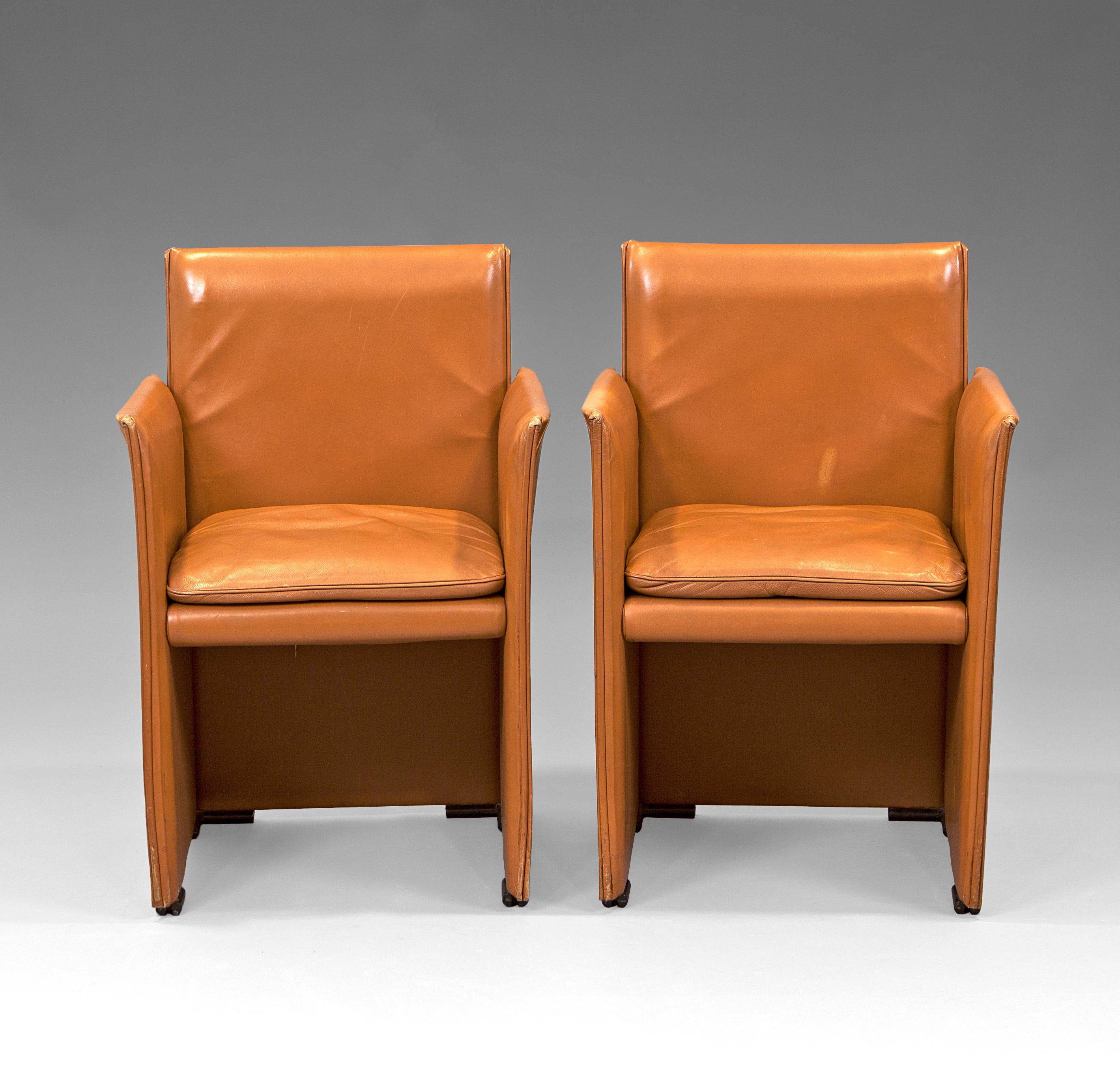 “401 Break” leather armchairs by Mario Bellini for Cassina. Rigid metallic structure covered in cognac leather. Italy, 1980s. This design is included in the 20th century design and architecture collection of the Metropolitan Museum of Art (MoMa).