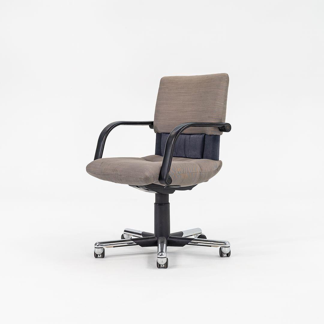 This is a Figura Desk Office Chair, initially designed by Mario Bellini for Vitra in 1979. These examples date to both 1984 and 1994, as we have six available for purchase. The listed price includes one office chair. These retain their original