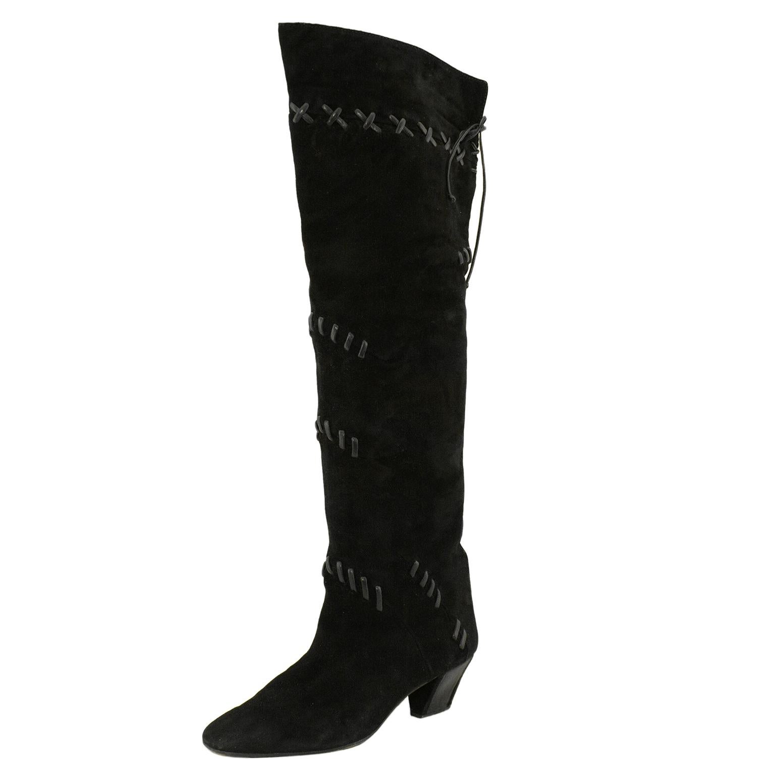 1980s Mario Valentino black suede knee high boots with whipstitch detail. The boots have an almond shaped toe box and a low to mid height block heel. Pirate inspired, the gorgeous boots come to the knee and the top flap can be worn up or folded