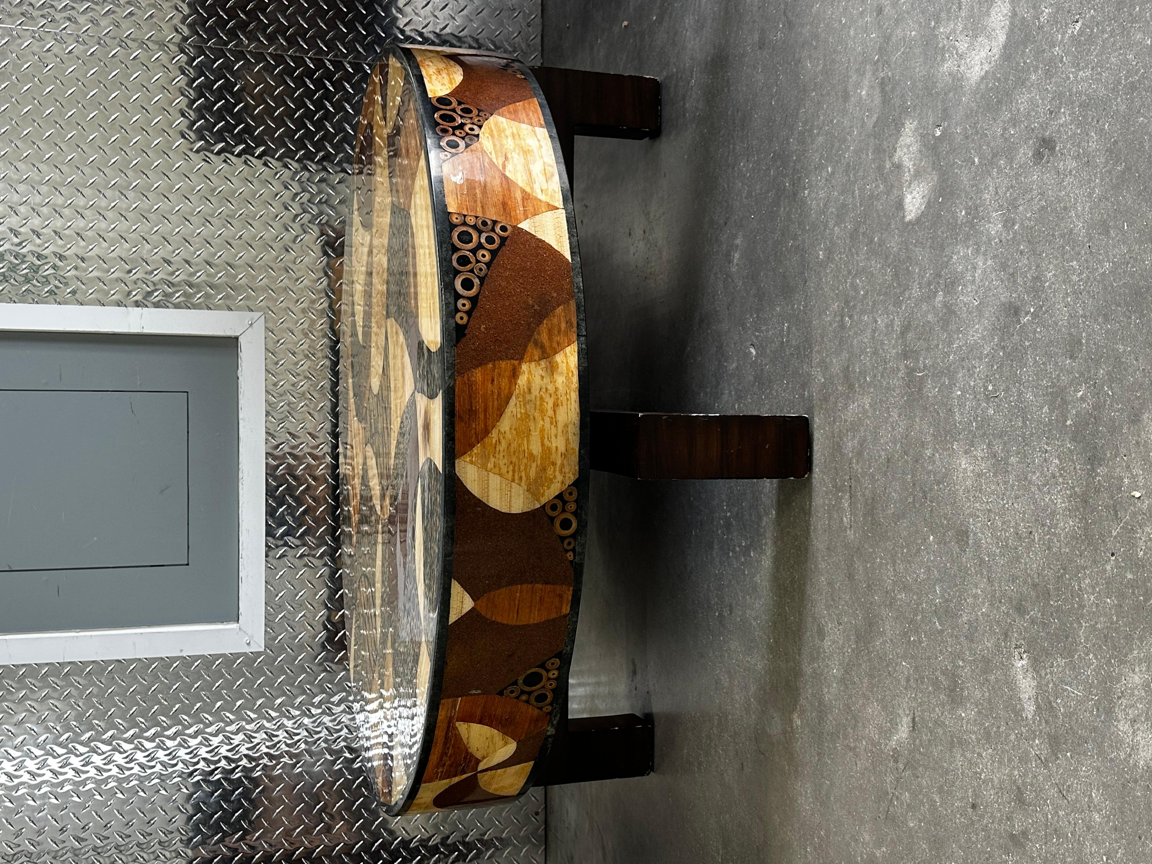 On offer on this occasion is one of the most stunning coffee table you could hope to find. Rectangular coffee table in the style of Roger Capron dating from the 1970s. The table has a wood structure and legs with a ceramic and stone top. It has one