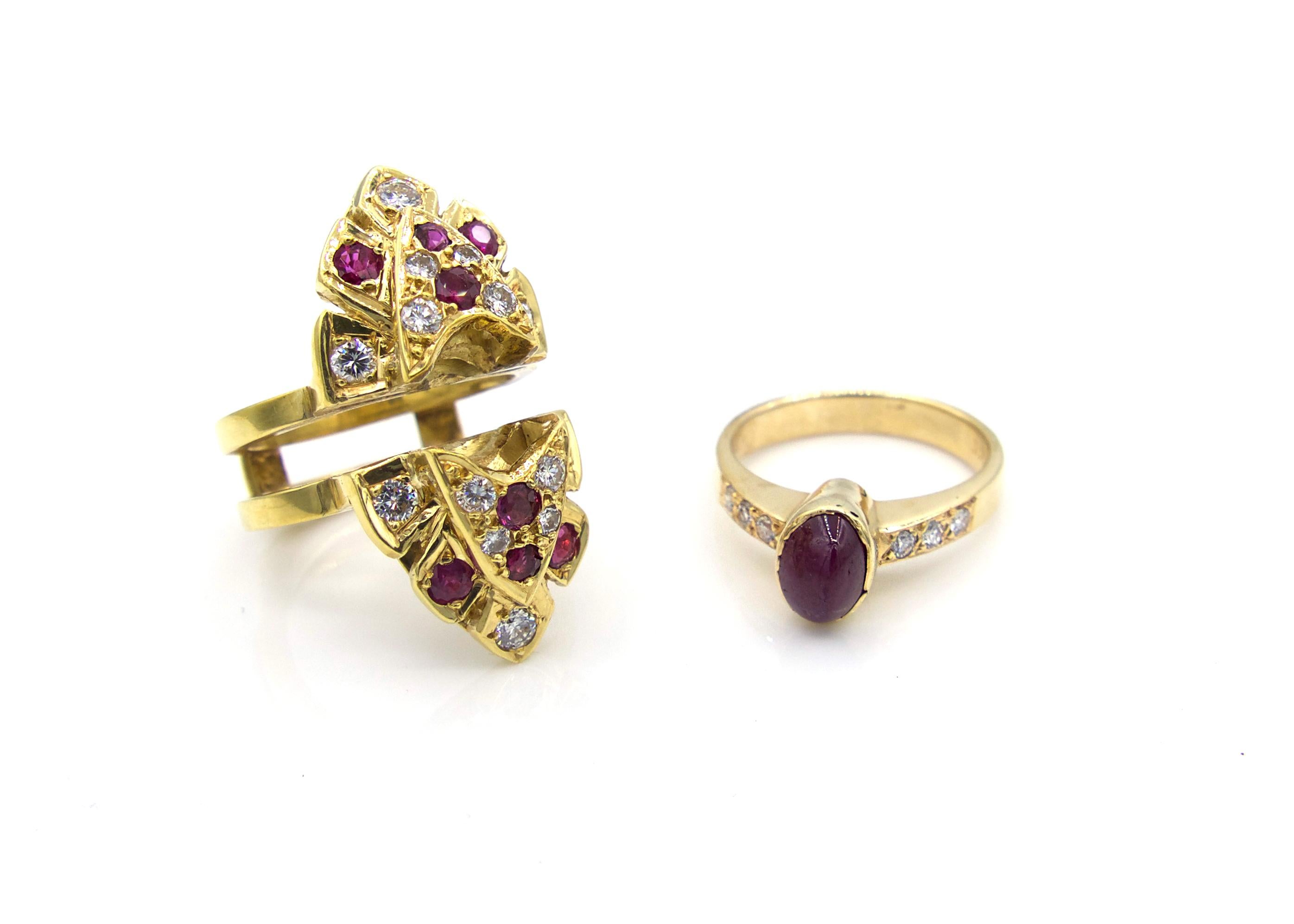 This remarkable 1980s marquise-shaped ring comes as a two-part set. The inner band is made of 14K yellow gold with an oval cabochon ruby at its center, flanked by 3 round-cut diamonds on both sides. The larger marquise-shaped outer piece, in which