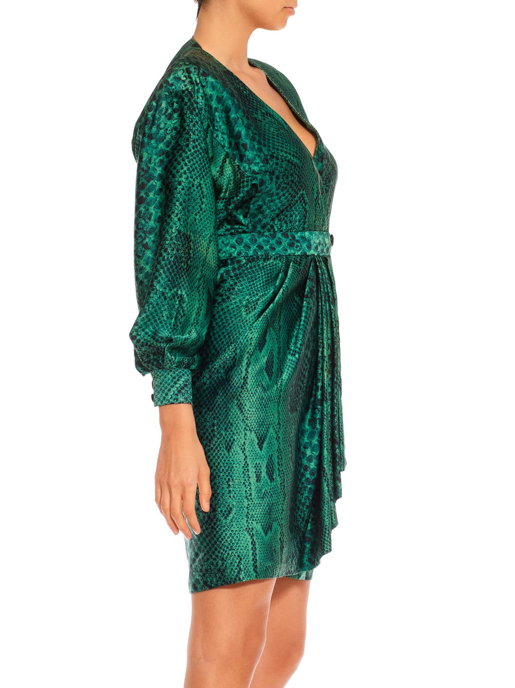 The body of the dress is self lined with the satin against the skin for added luxury, glass buttons and hand-finished. Some slight fading and areas of discoloration. Wrap dress design can be easily sized from a 4 to a 12 1980S Martha’S Emerald Green