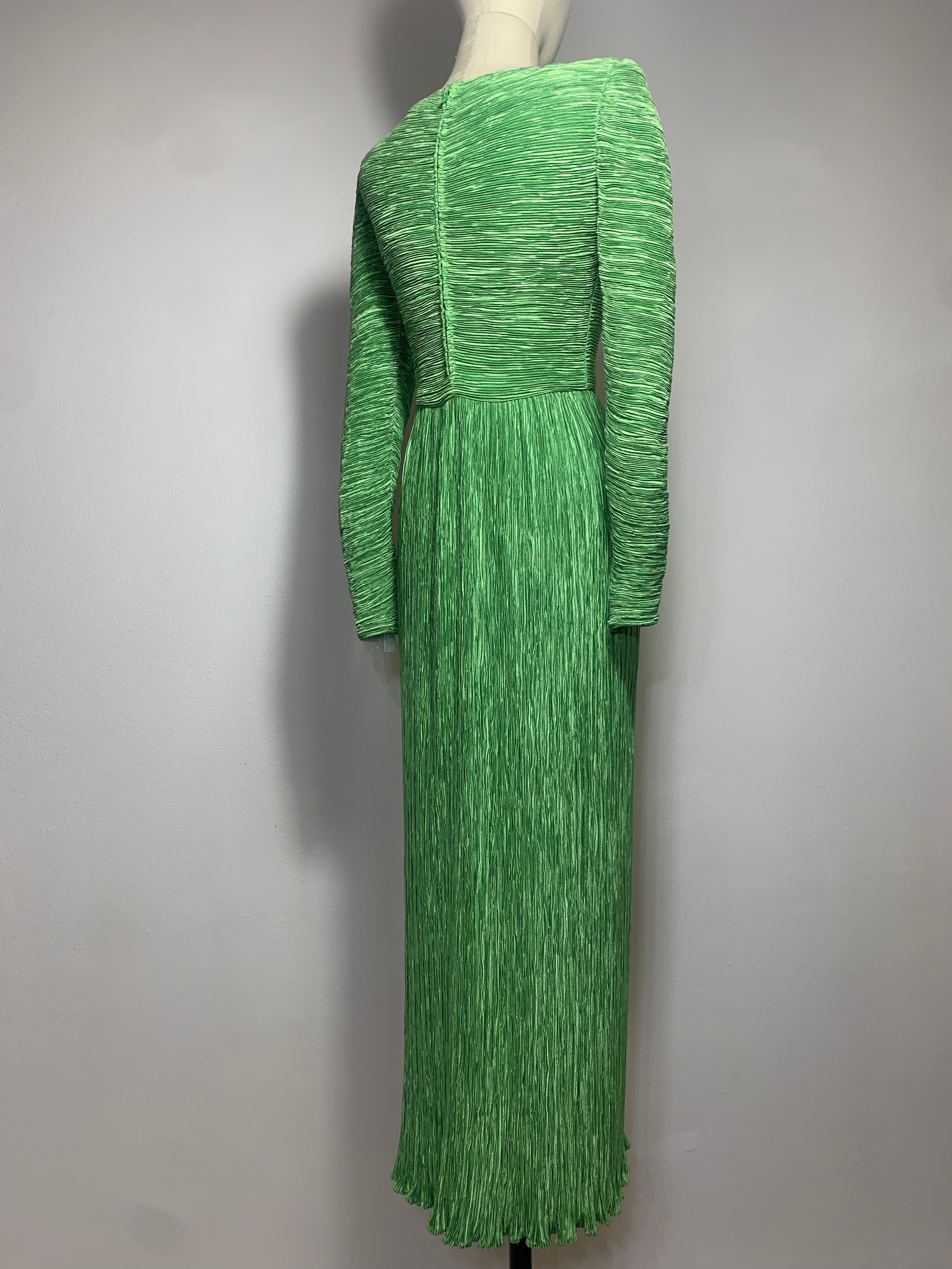 1980s Mary McFadden Jade Green Fortuny-Style Silk Column Gown w Long Sleeves:  Signature McFadden style with an asymmetrically draped bodice and long tapered sleeves. Bodice is lined, skirt is not, for ease of movement.  Slightly padded shoulder