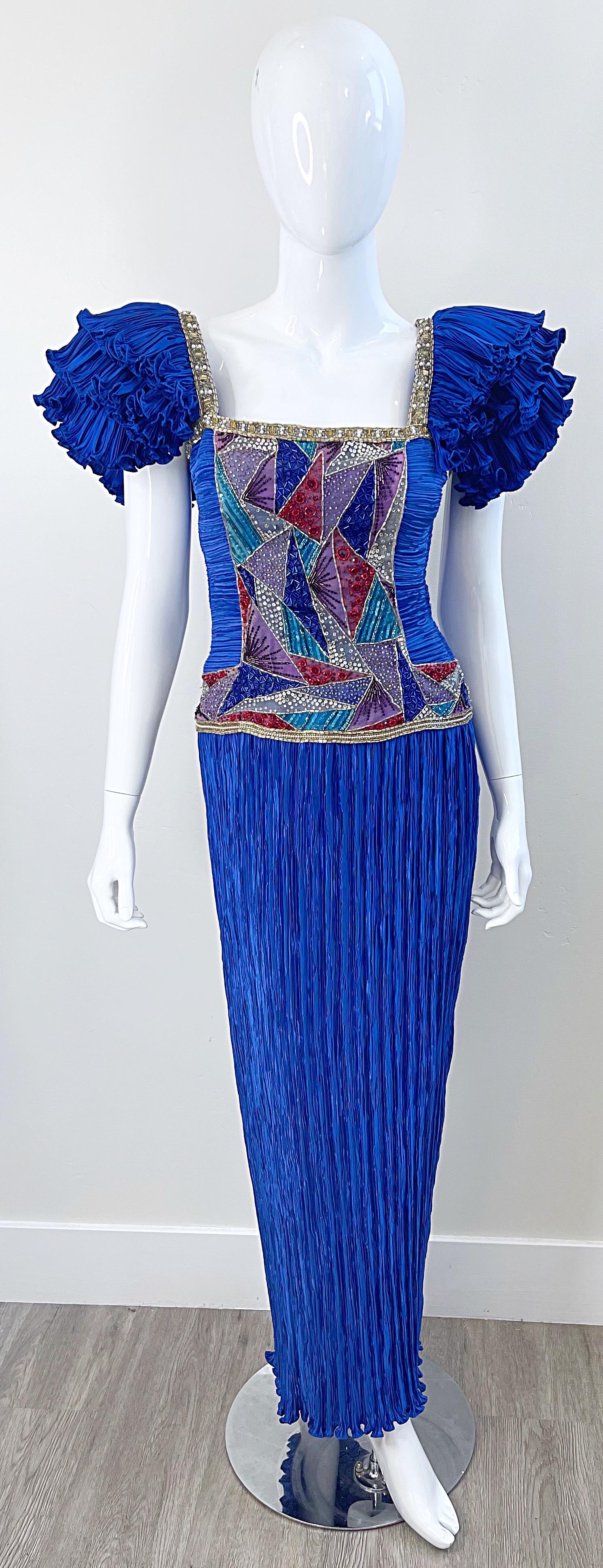 Gorgeous 1980s MARY MCFADDEN for NEIMAN MARCUS royal blue fortuny pleated evening gown ! Features Avant Garde ruffle sleeves. Thousands of hand-sewn sequins, beads and pearls encrusted throughout the front and back bodice. Boned interior holds
