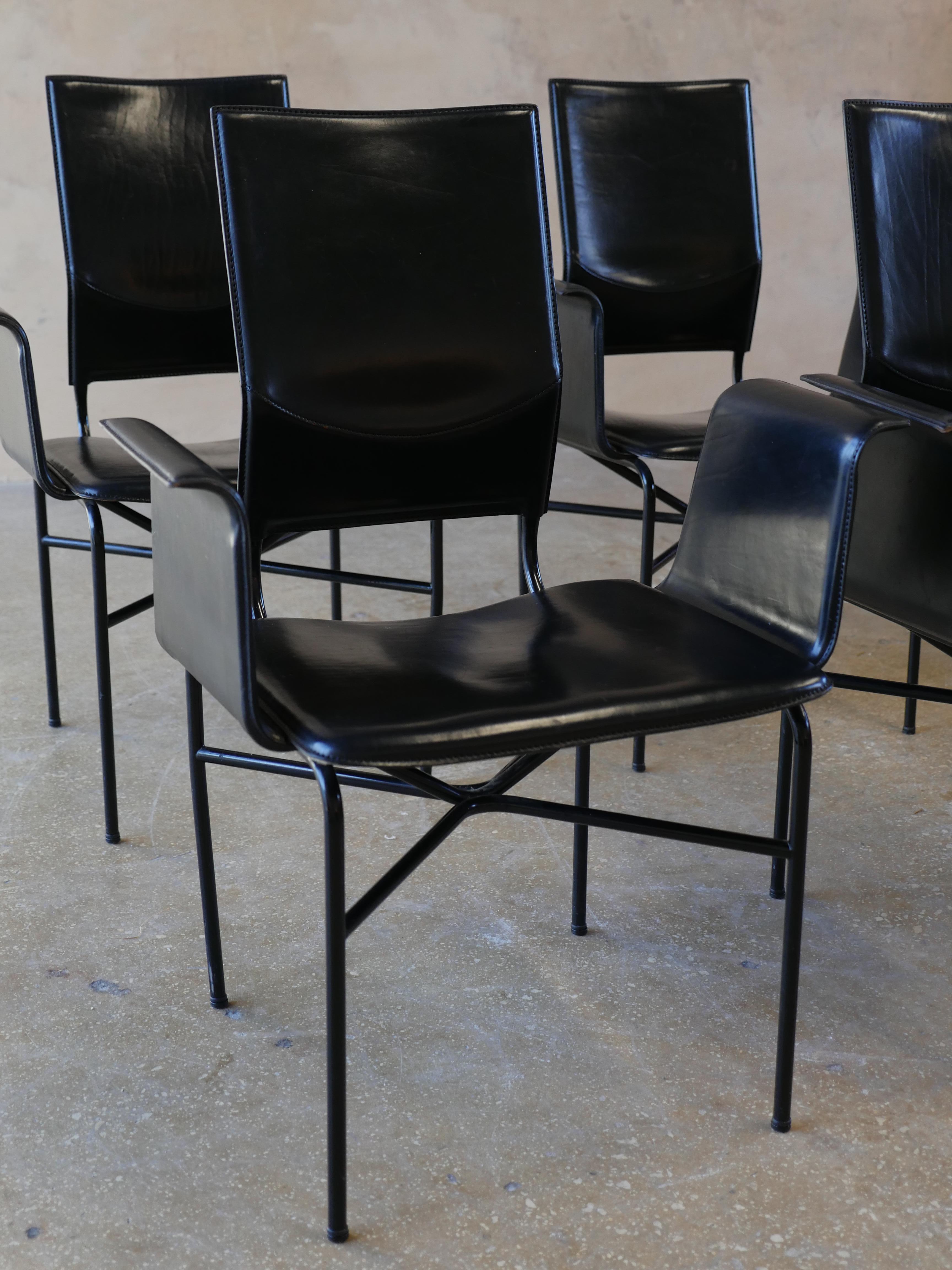1980s, four beautiful black leather and steel armchairs by Ross Littell, for Matteo Grassi. The supple leather on the chairs is as soft to the touch today, as the day they were made. The winged arms on the chairs are a timeless design that fit well