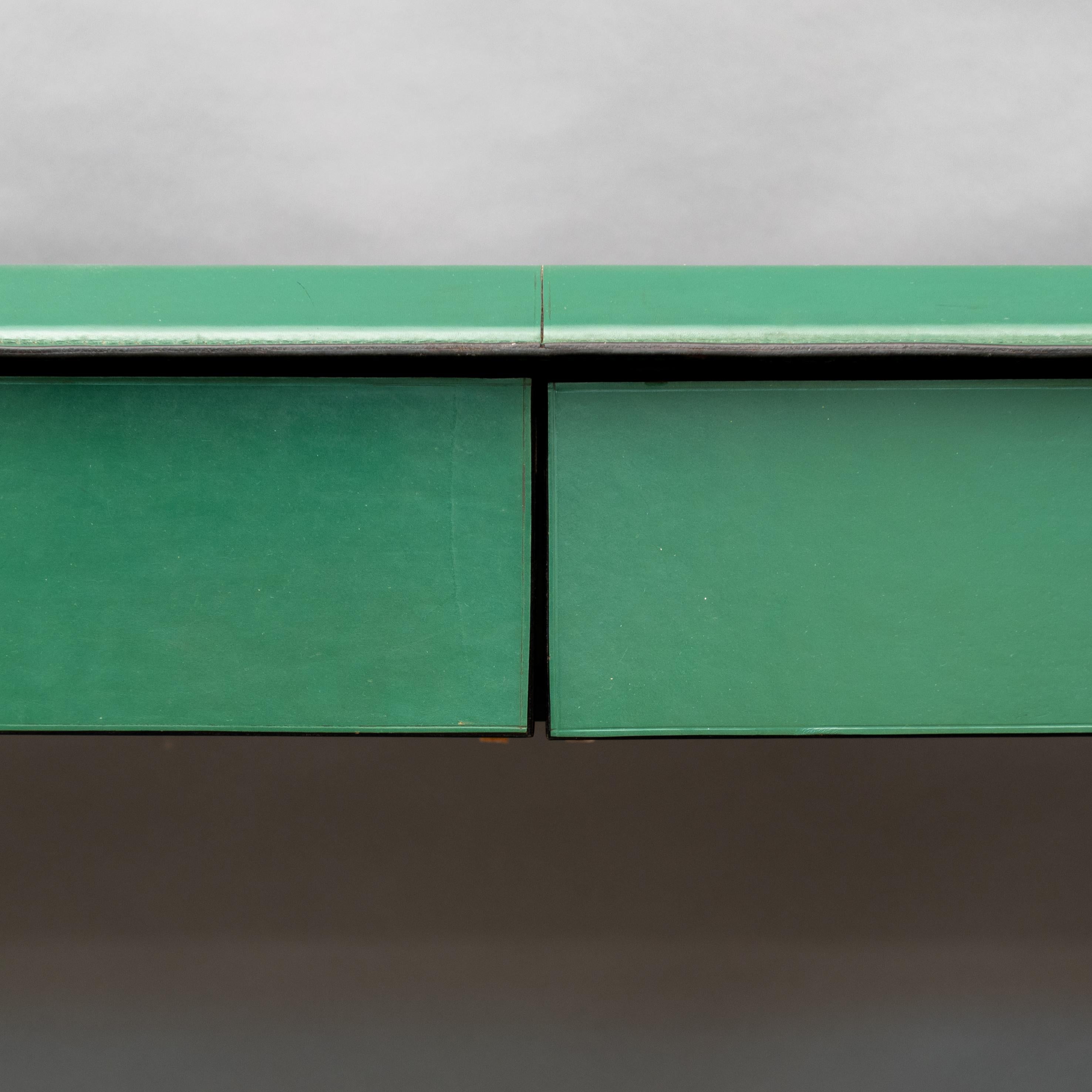 Sleek wall-mounted console table of green leather  with 2 drawers by Matteo Grassi.
Original Italian wall hung green leather clad console table with black interiors.
Totally upholstered in her original leather, this item comes from a private