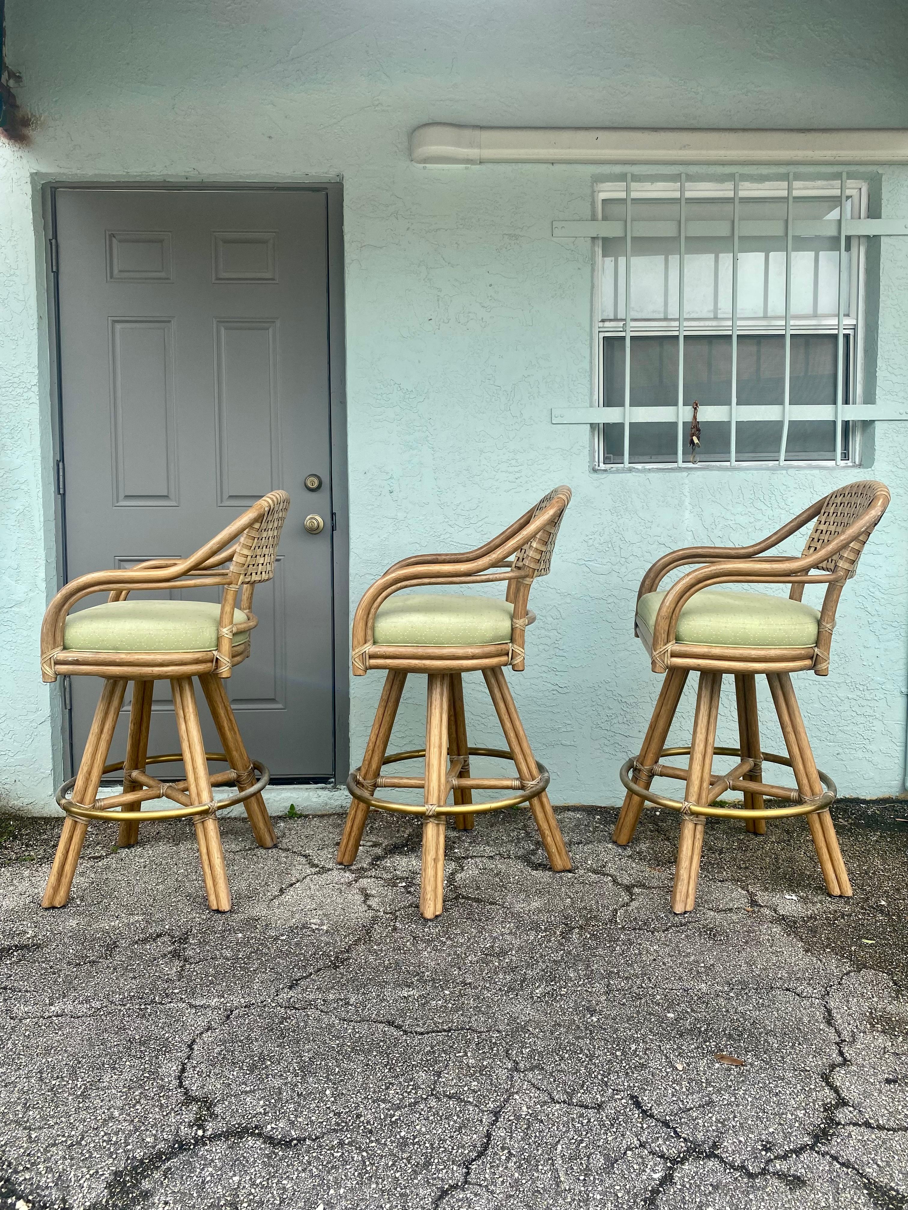 1980s McGuire Swivel Rattan and Leather Bar Stools, Set of 3 In Good Condition For Sale In Fort Lauderdale, FL
