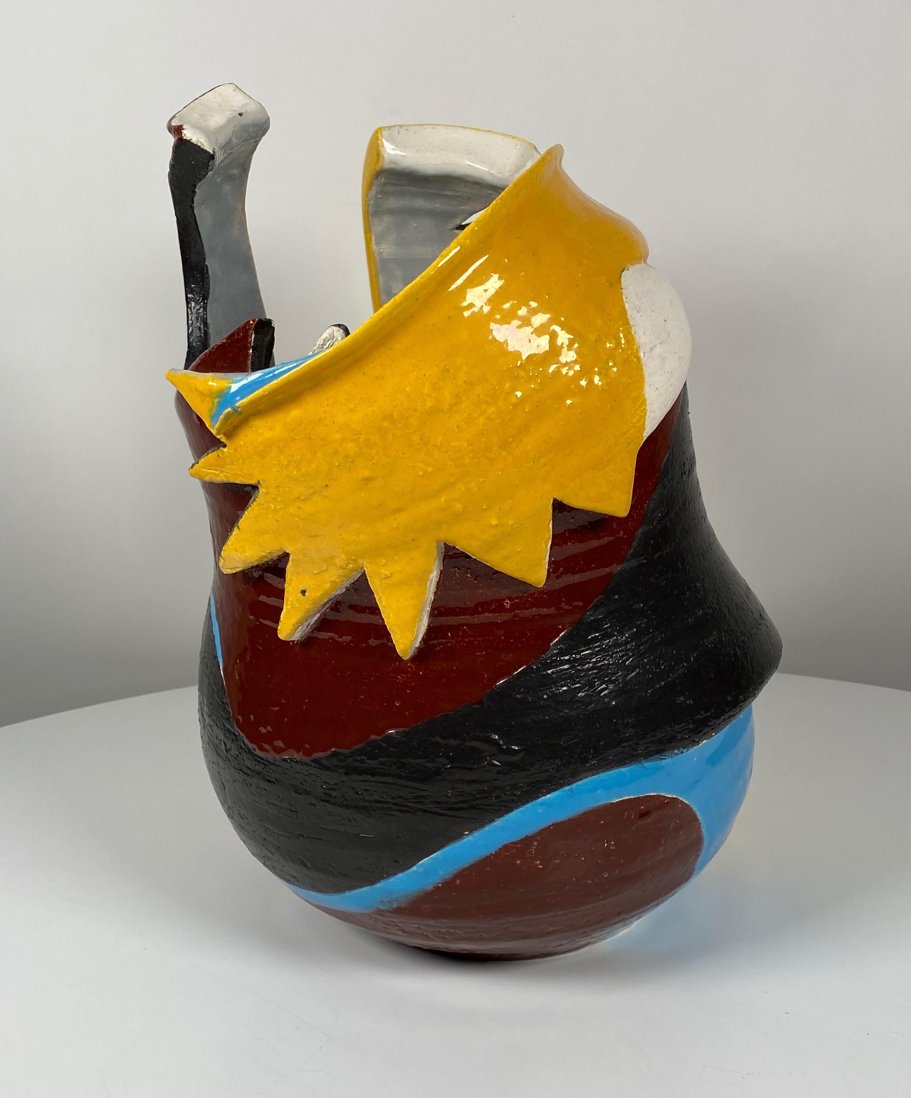 1980s Memphis Style ceramic sculpture by Northern Californian artist Neil Williams (1959- ), the sculpture is a vessel that has been deconstructed into a abstract form with multiple colors of glazes and patterns on the piece creating complex