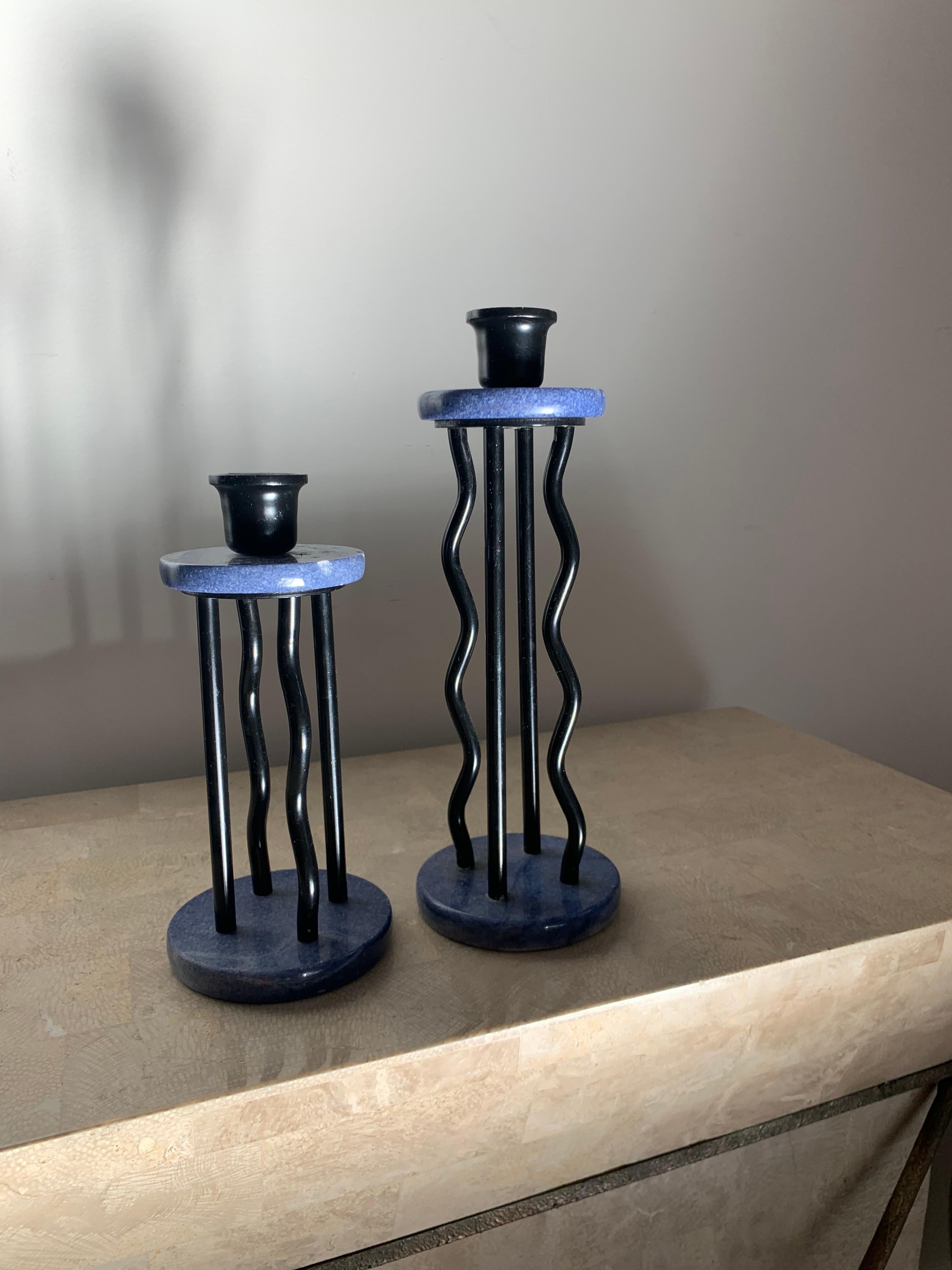 Rare pair of vintage Memphis Milano candlesticks in black lacquer and denim toned marble. Some signs of age but - relics of history.

Measures: Taller 10” tall, short 8” tall.