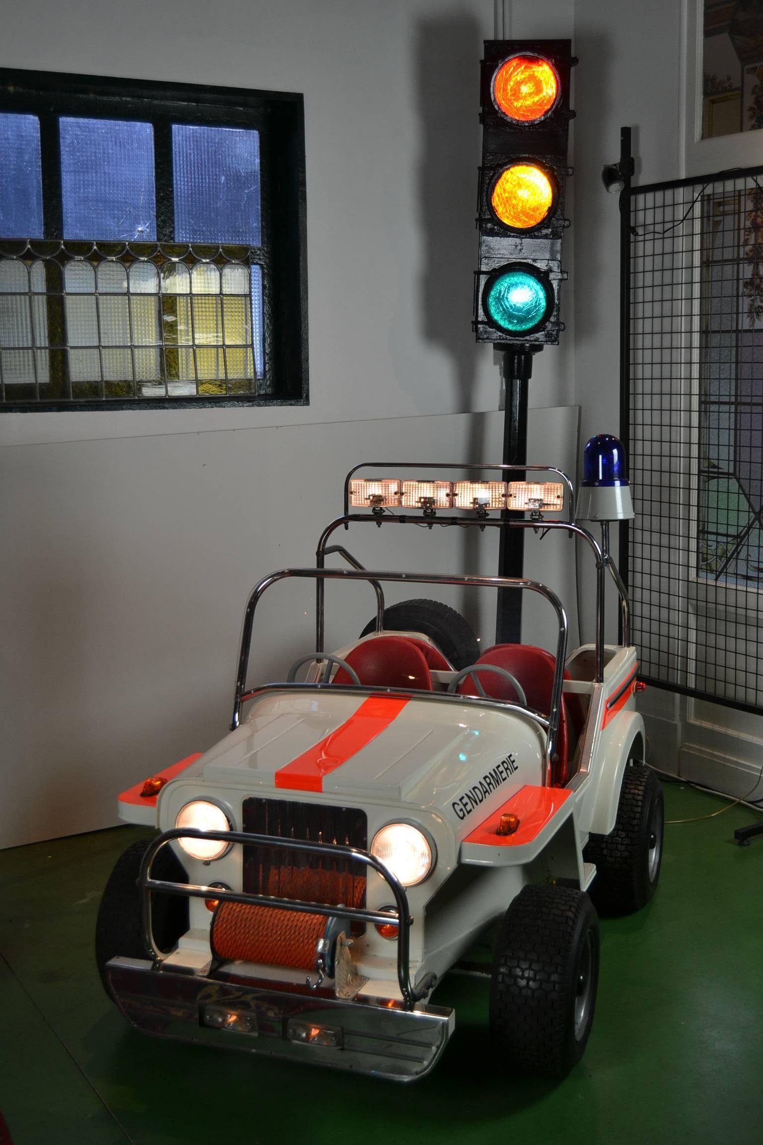 Exceptional Fairground Jeep ,
a Metal Children's Jeep Car made by Atelier L' Autopède Belgium.
It was Handmade in the Eighties by Alain Baeyens, the Son of Karel Baeyens. 
They were specialised in making Metal Carousel Rides. 
The quantity of items