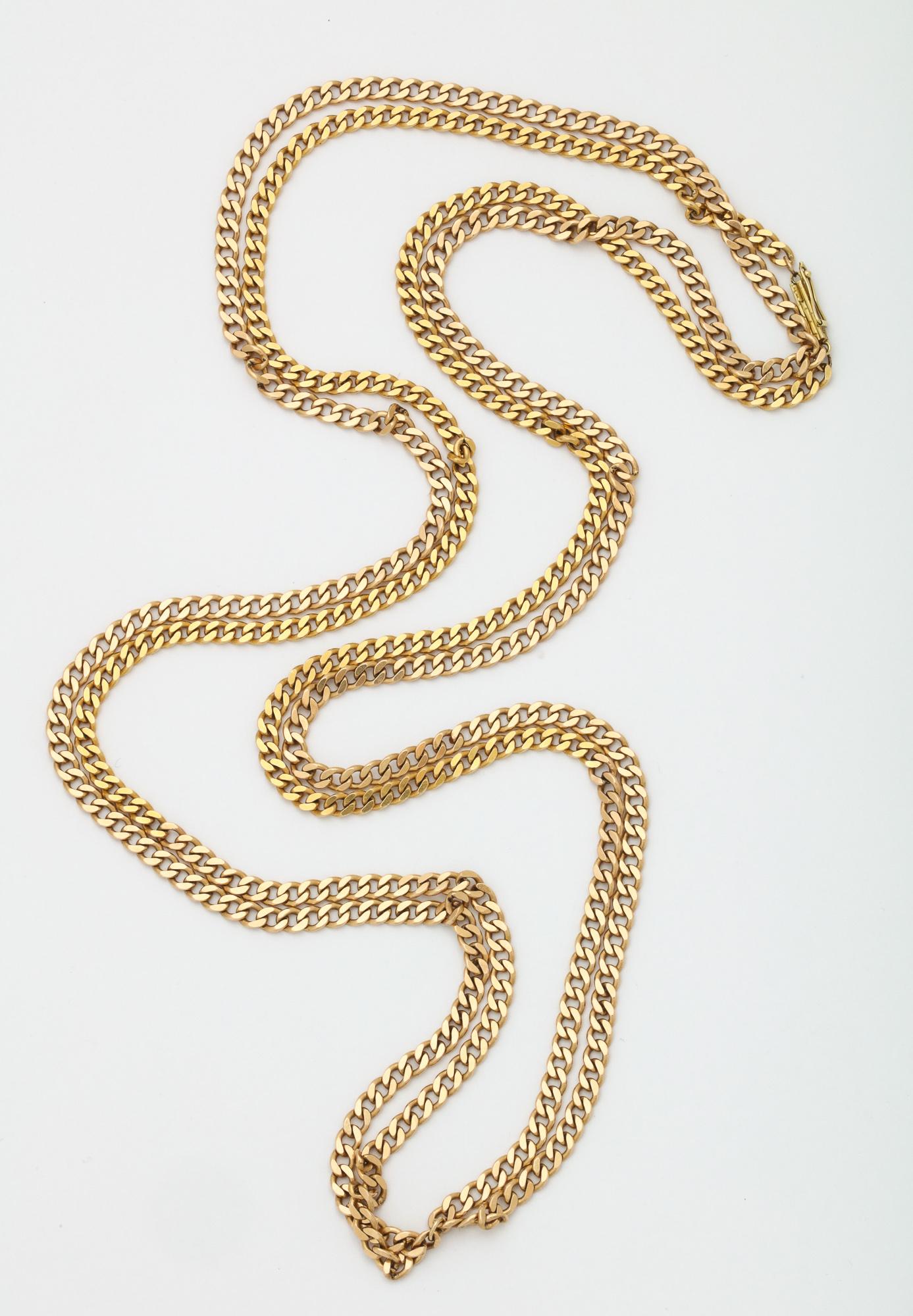 One Unisex Chain Composed Of A Double Strand Of 14kt Gold Open Flat Links Measuring 30 Inches Long. NOTE: Chain Necklace May Be Worn Doubled For A Shorter Choker Length Style Open Link Necklace.Stamped 14kt. Made In The United States Of America.With