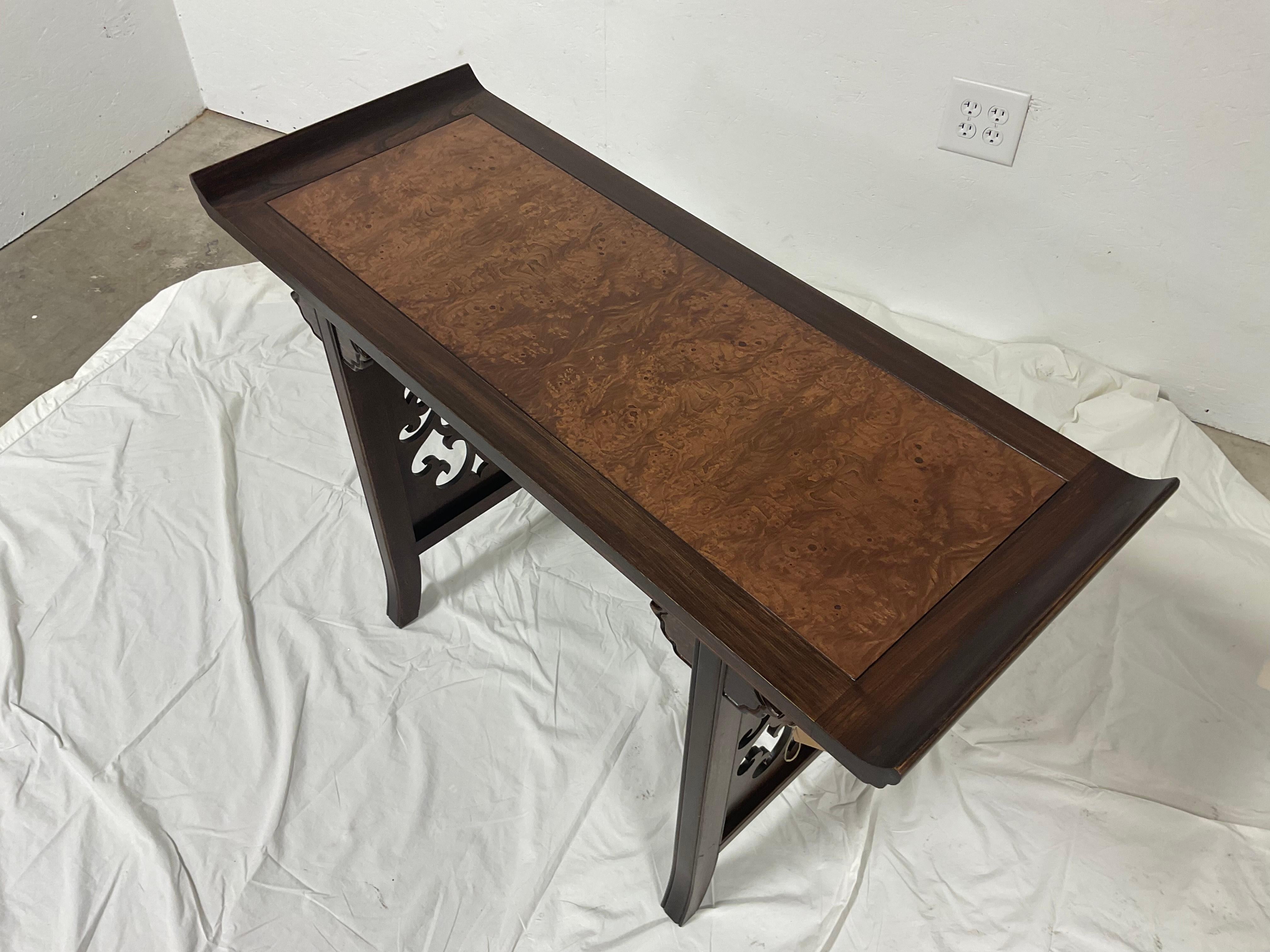 I love the size of this altar table, designed by Michael Taylor, for Baker Furniture. The size makes it useful, in so many locations. The center has a beautiful burl wood, with the remainder being decoratively carved walnut.