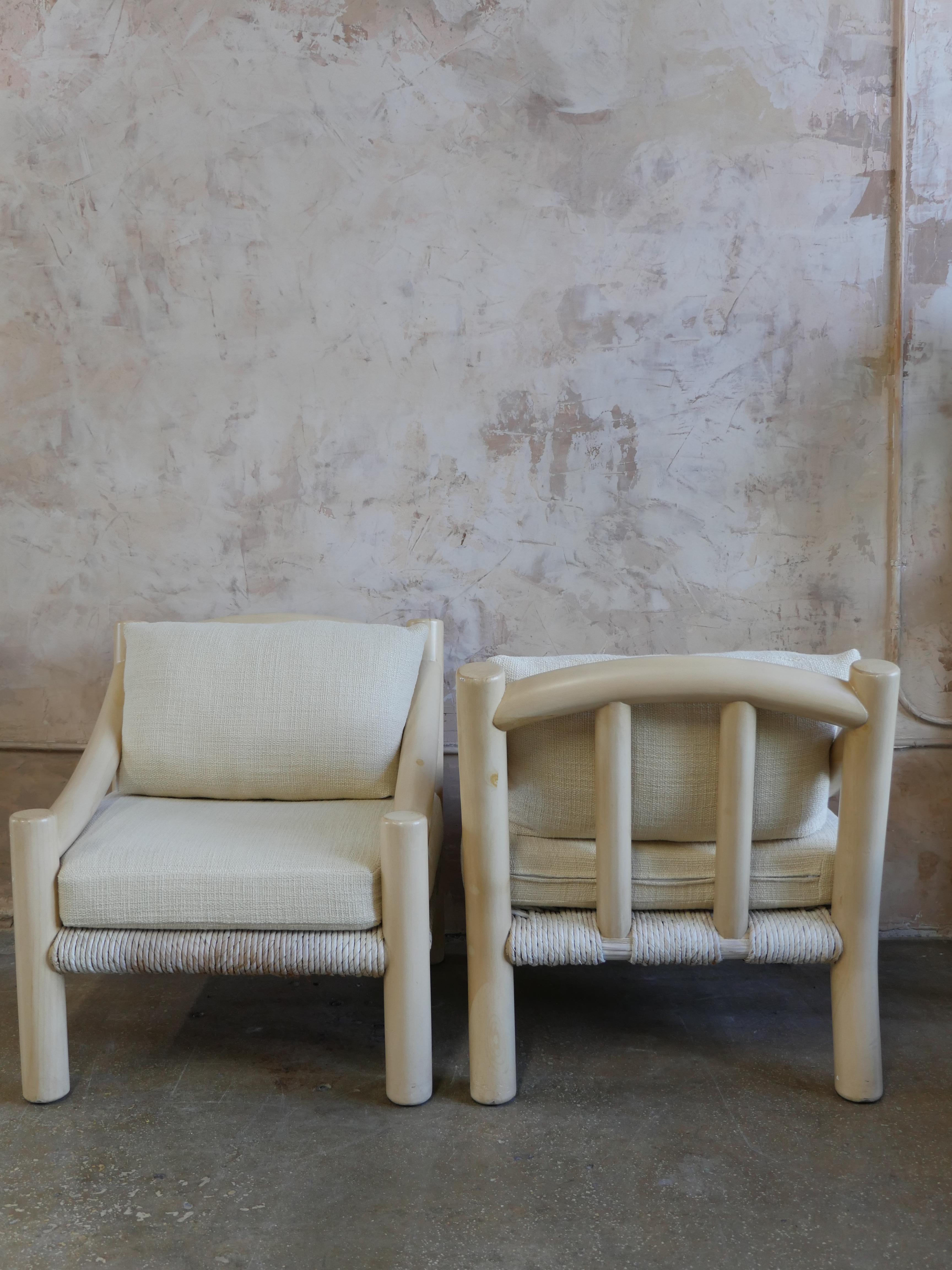 Beautiful pair of vintage 1980s Michael Taylor teak wood lounge chairs with luxurious linen upholstery by Elitis. The chairs chunky off-white lacquered teak wood frames our complemented nicely by the elegant Elitis linen and brand new cushions that