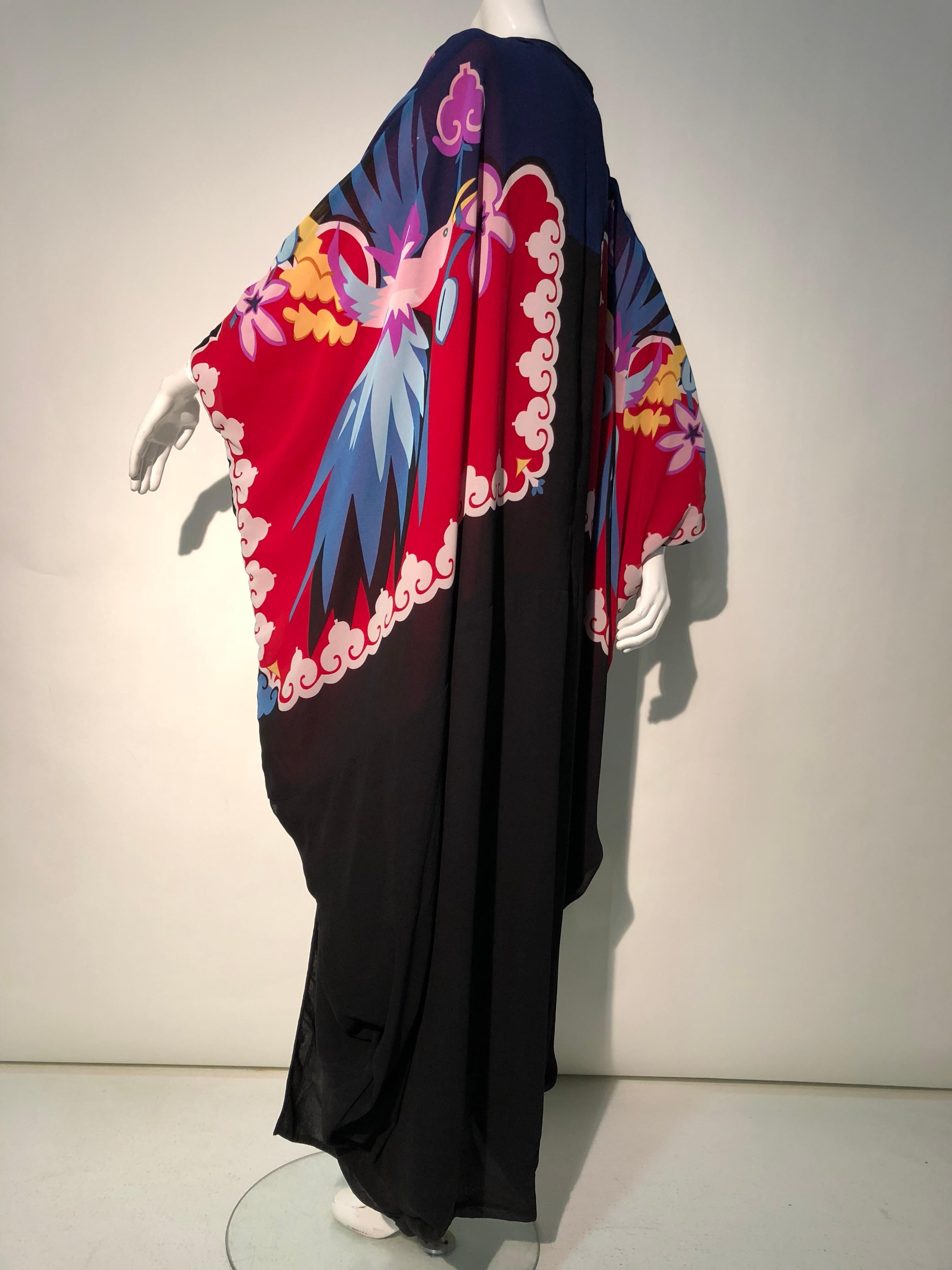 A 1980s Very Vollbracht by Michaele Vollbracht rayon crepe cocoon-styled Kimono embellished with his signature hand-painting. This piece features Art Deco-inspired stylized multicolor birds, florals and border motif panels set against a black