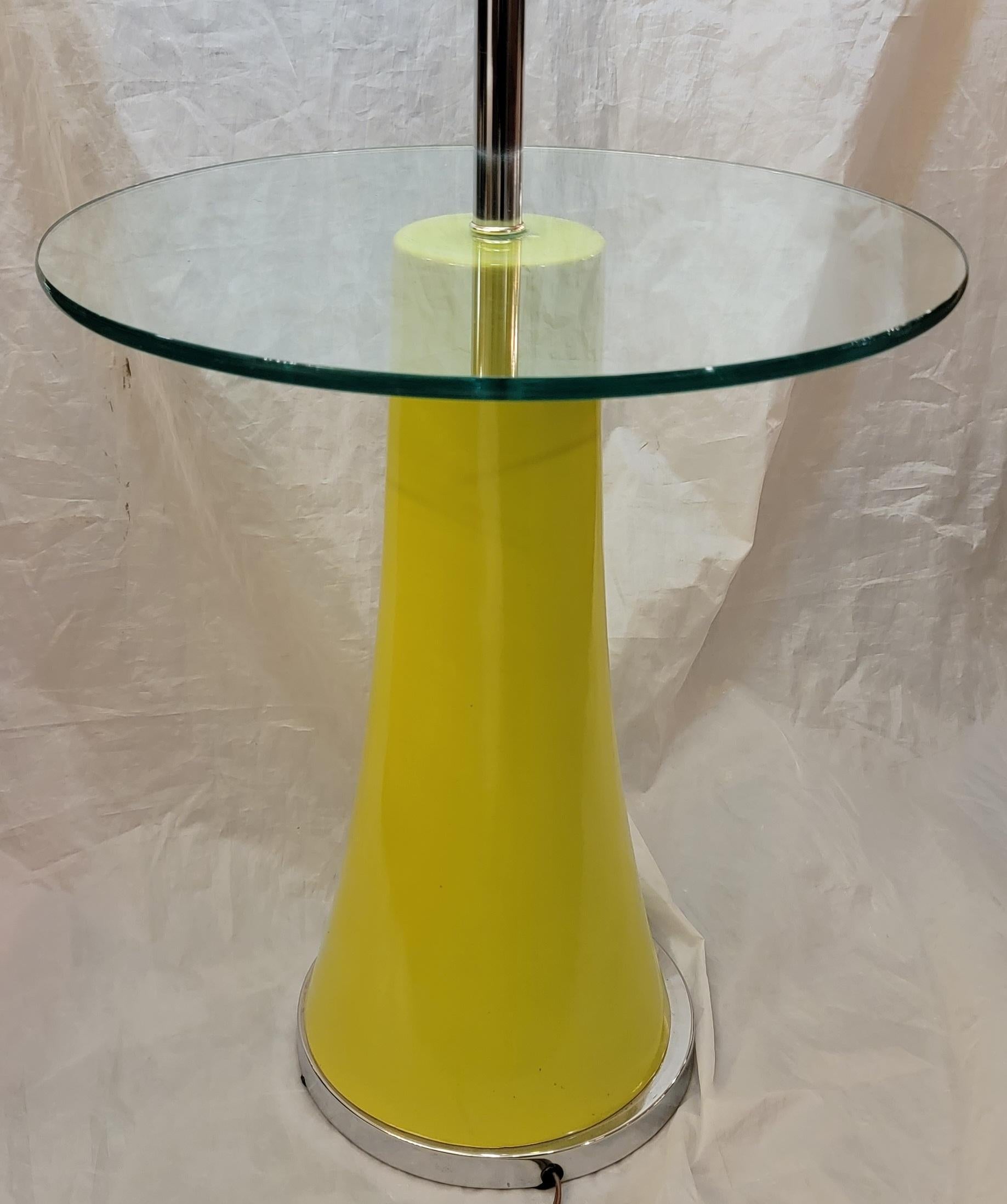 Midcentury chrome and lacquered floor lamp with round glass center table. The base is made from a painted laquer metal and has a unique greenish Yellow color.