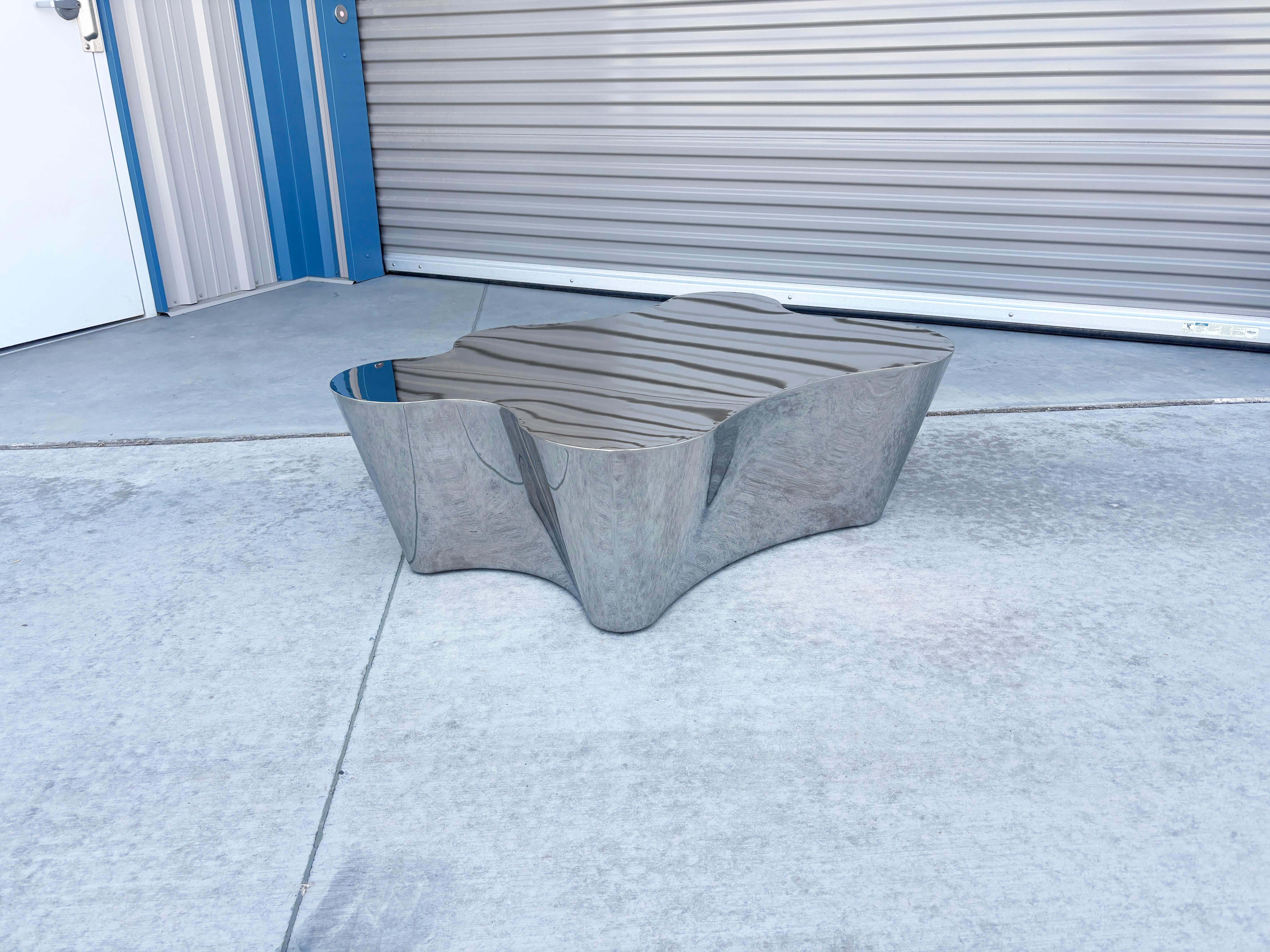 ✨ Sculptural Chrome Cloud Coffee Table ✨

This striking chrome coffee table is a true showstopper, blending futuristic design with organic elegance. Featuring a cloud-like, freeform silhouette, its high-polish chrome finish reflects light