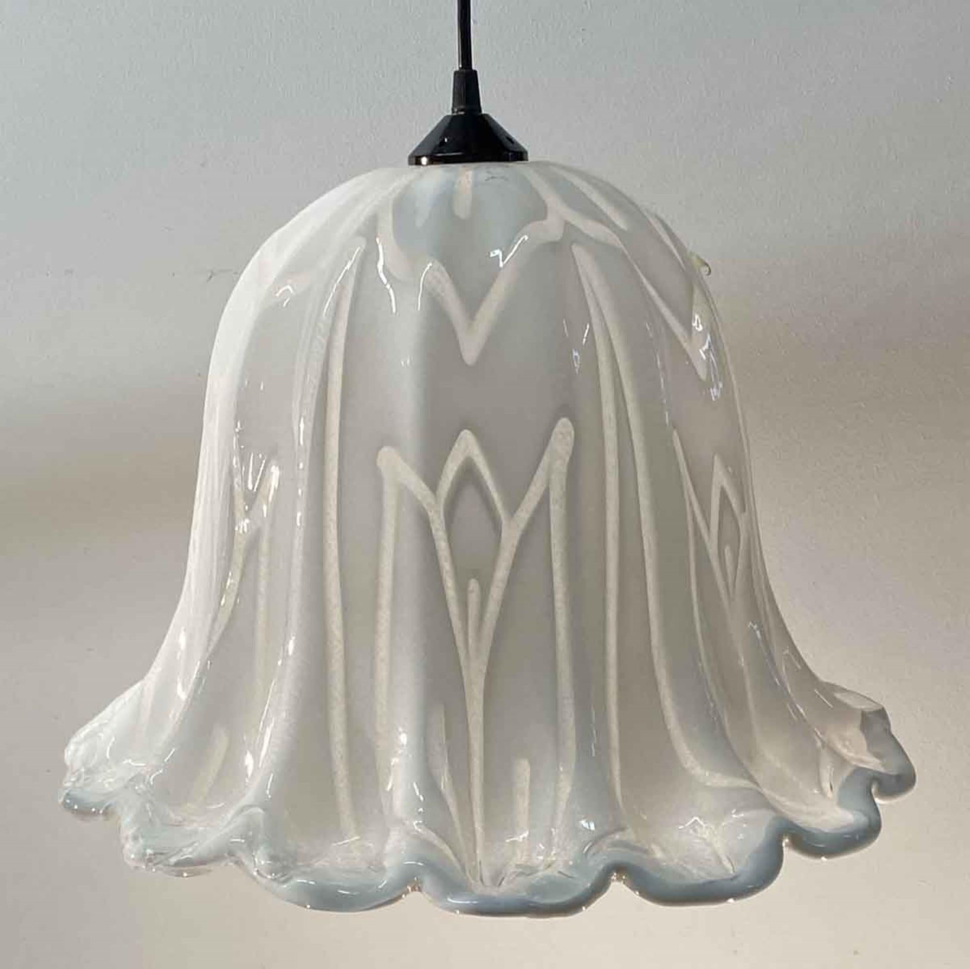 1980s hand made white Mid-Century Modern Murano glass pendant light done in a tulip style. The fitter can be done in a white cord, black cord, antique brass pole, or a polished nickel pole. Please specify. Measures: 16 In. diameter. This can be seen