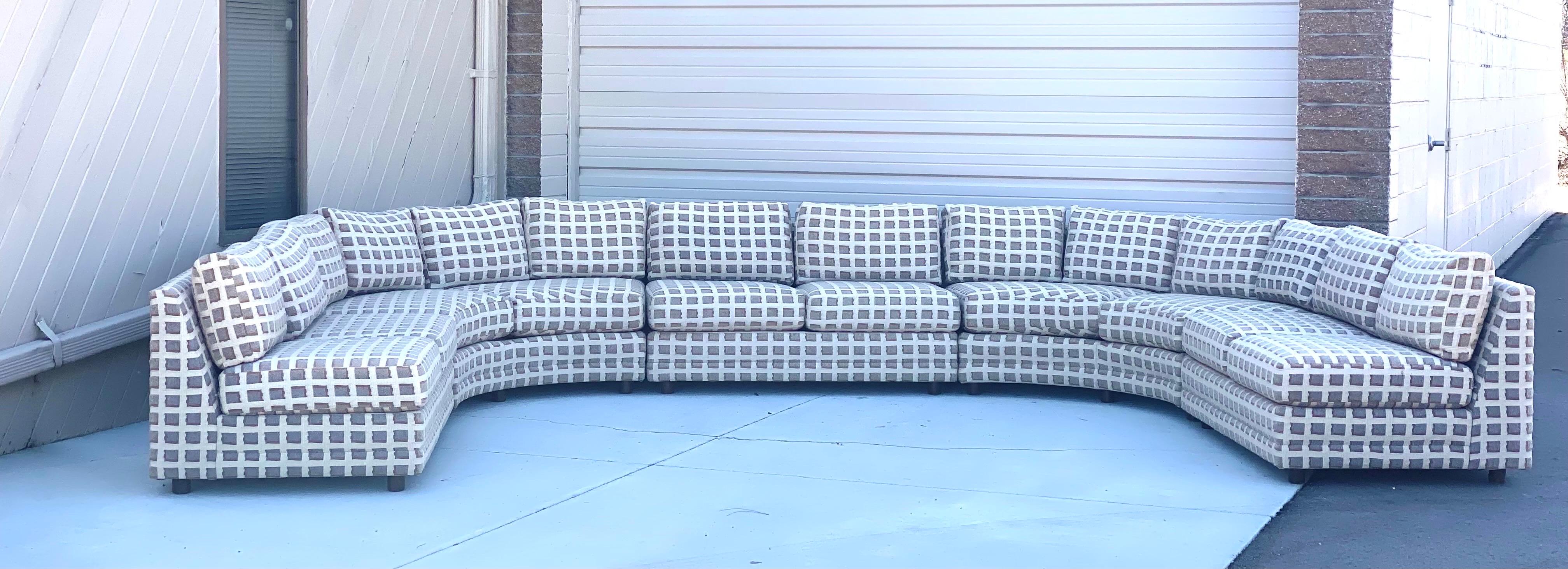 We are very pleased to offer a monumental, custom made, five-piece semicircular sectional, circa the 1980s. Showcasing clean Mid-Century lines and unequaled comfort, this large sofa is perfect for lounging with the family, entertaining, or just