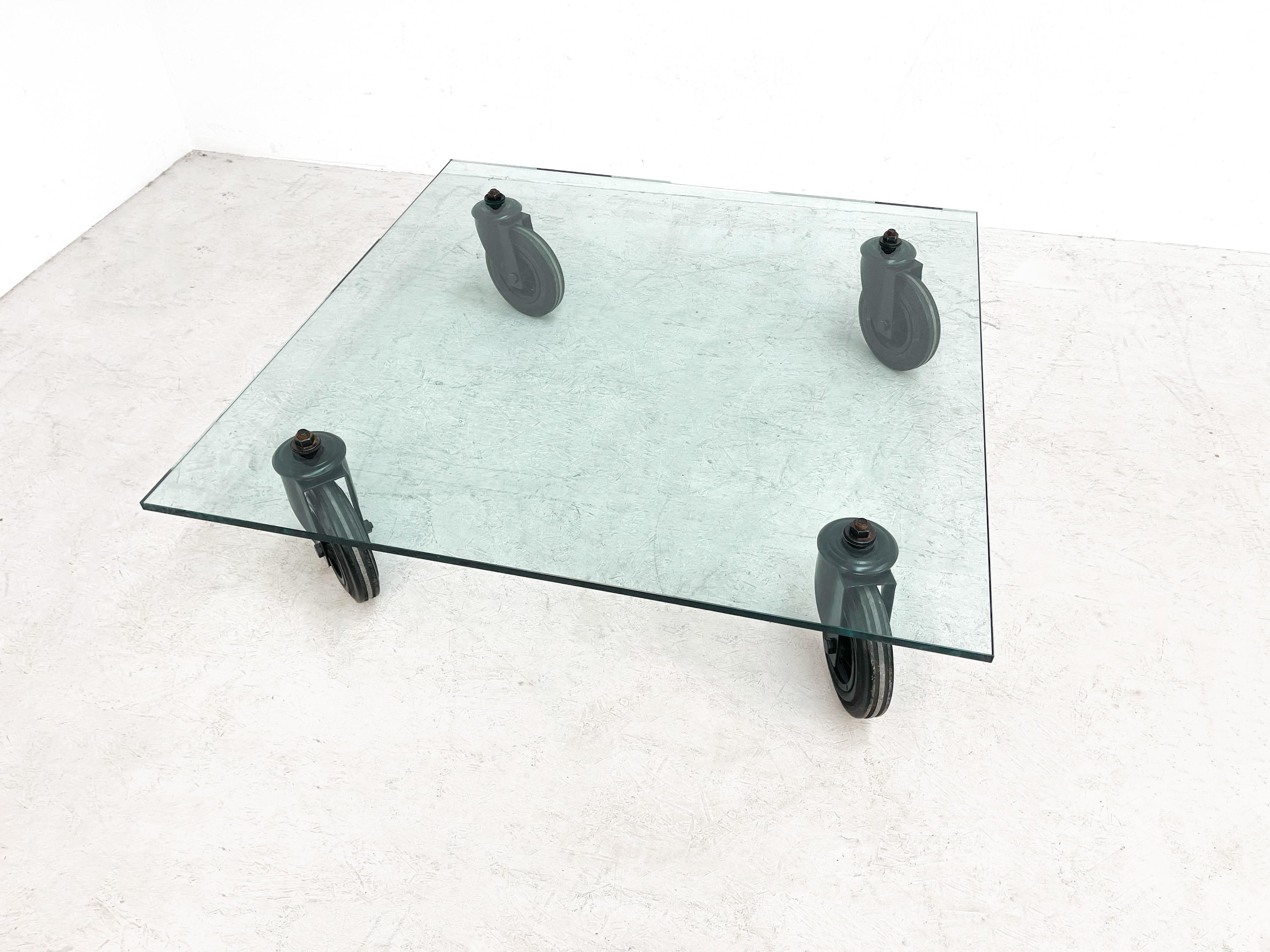 Very elegant coffee table by 1 of most famous and iconic Italian designers Gae Aulenti. Gae Aulenti designed this table for Fontana Arte in the 80s. The design behind this piece of iconic design is based on a trolley she used to transport glass in