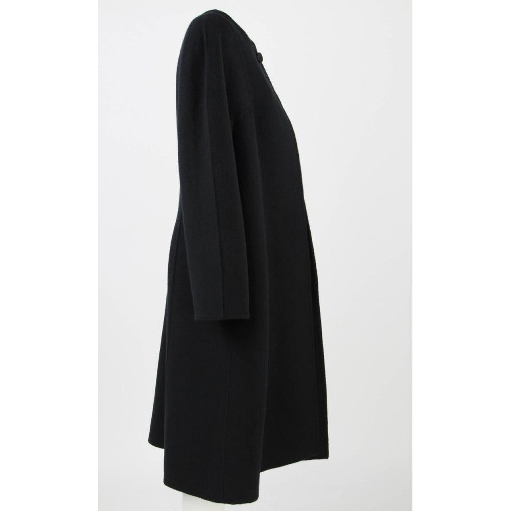 Mila Schön virgin wool and black Angora blend coat. Round neck model, single button and long raglan sleeves. 

Years: 80s
Made in Italy

Size: 46 IT  
Flat measurements 
Height: 113 cm 
Bust: 54 cm 
Shoulders: 50 cm 
Sleeves: 63 cm