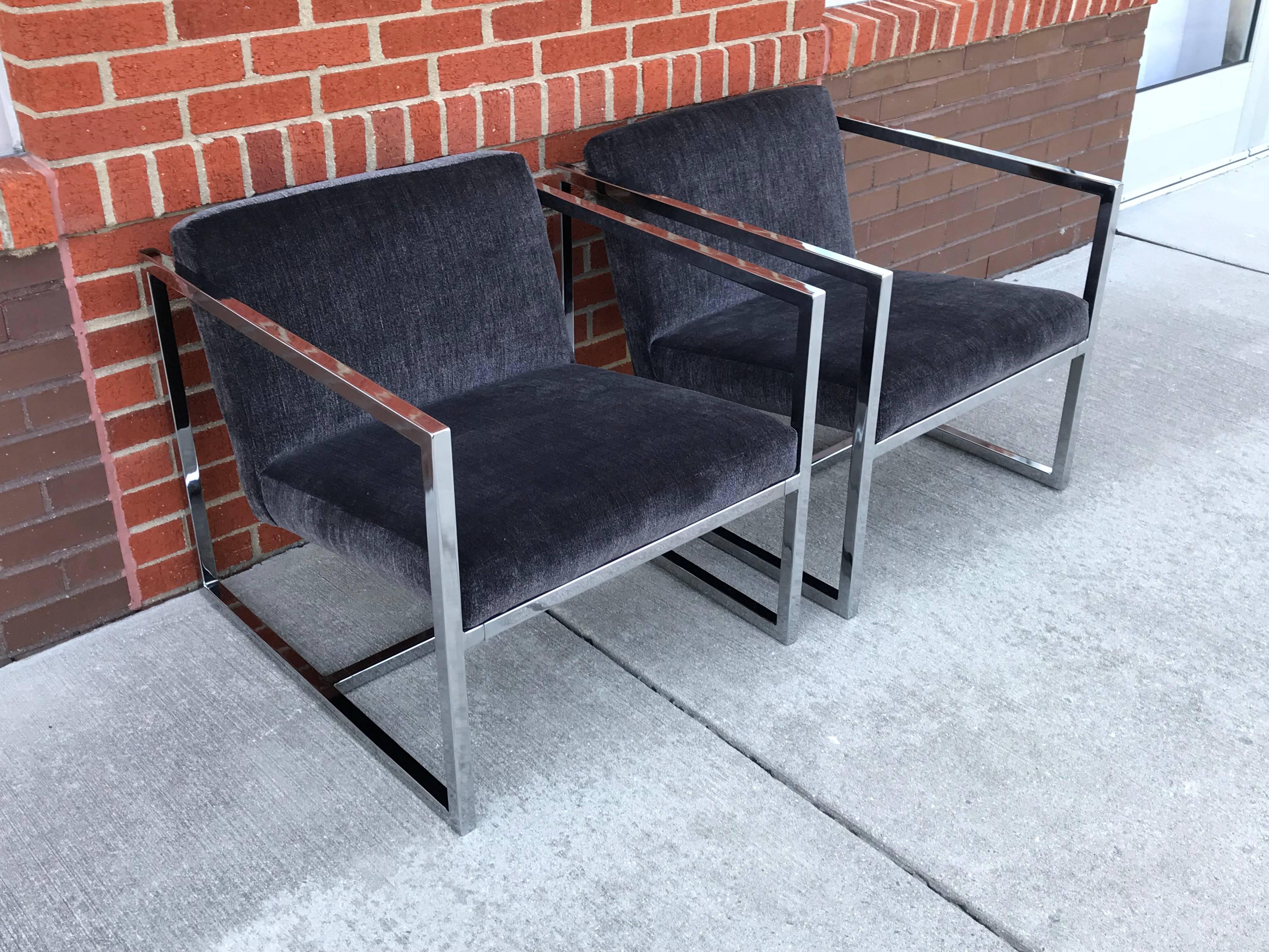 Offered is a fabulous, pair of 1980s Milo Baughman style polished-chrome cube chairs. The pair have been newly reupholstered in a gray Scalamandre velvet. Professional upholstery included new foam too. Heavy. Measure: Arm height is 23in.